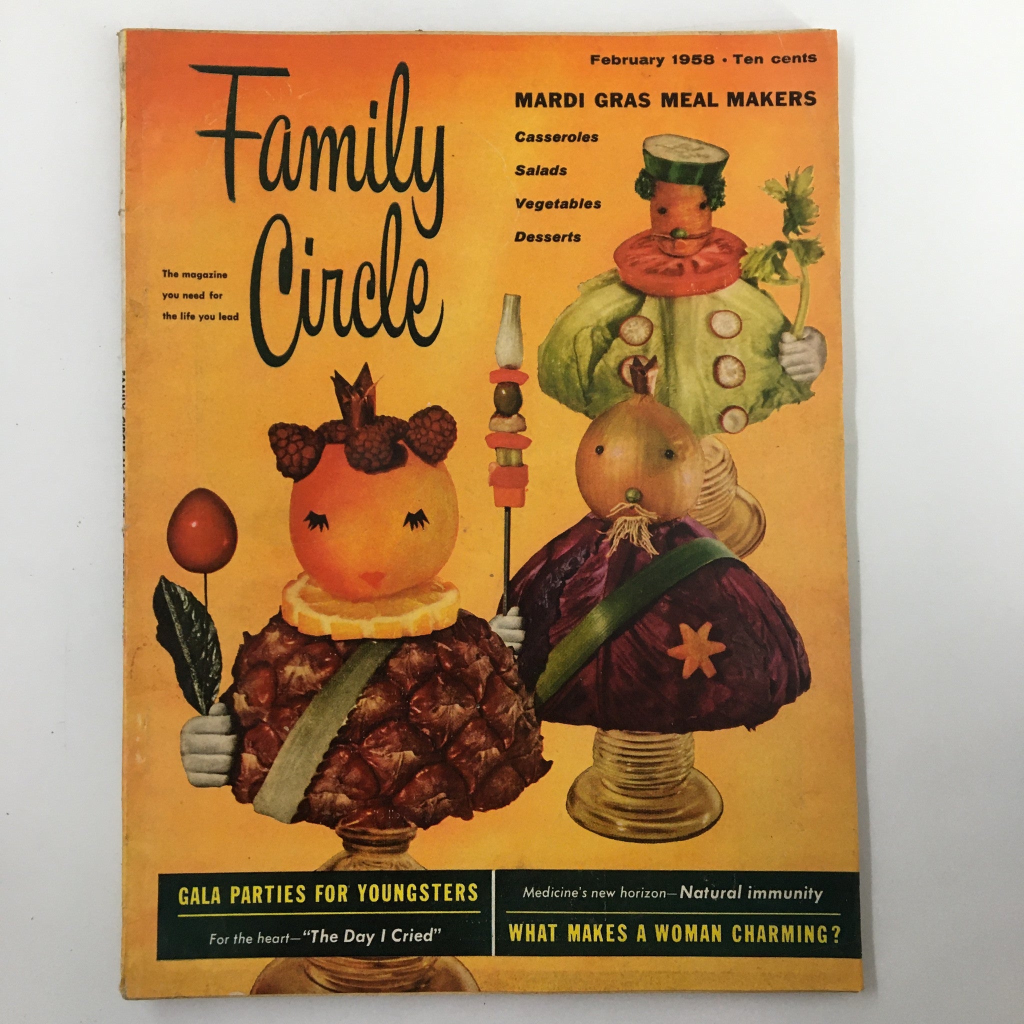 Family Circle Magazine cover from February 1958 featuring Mardi Gras Meal Makers theme, showcasing vibrant food imagery including casseroles, salads, vegetables, and desserts.