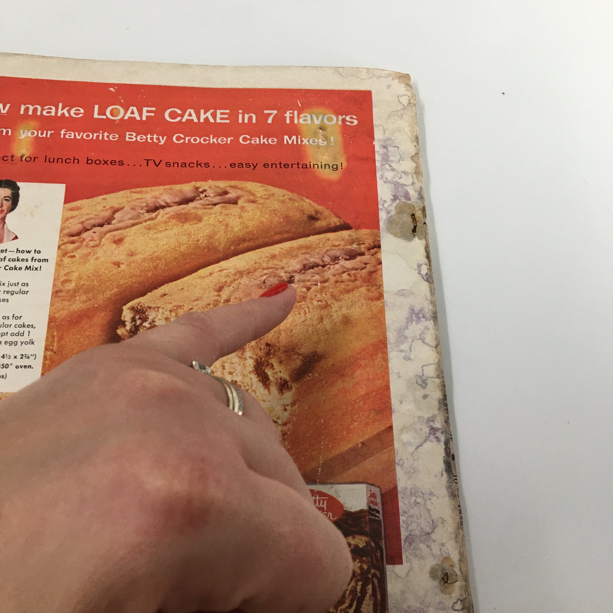 Close-up of a Betty Crocker advertisement from Family Circle Magazine June 1954, illustrating multiple flavors of loaf cakes and inviting readers to enjoy easy entertaining and snack ideas.