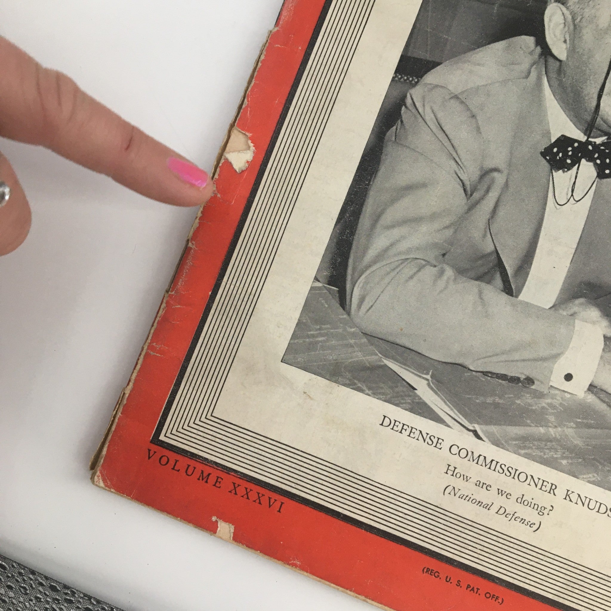 Close-up of the Time Magazine October 7 1940 showing additional wear details, highlighting the edge and condition of the cover featuring Defense Commissioner William S. Knudsen.