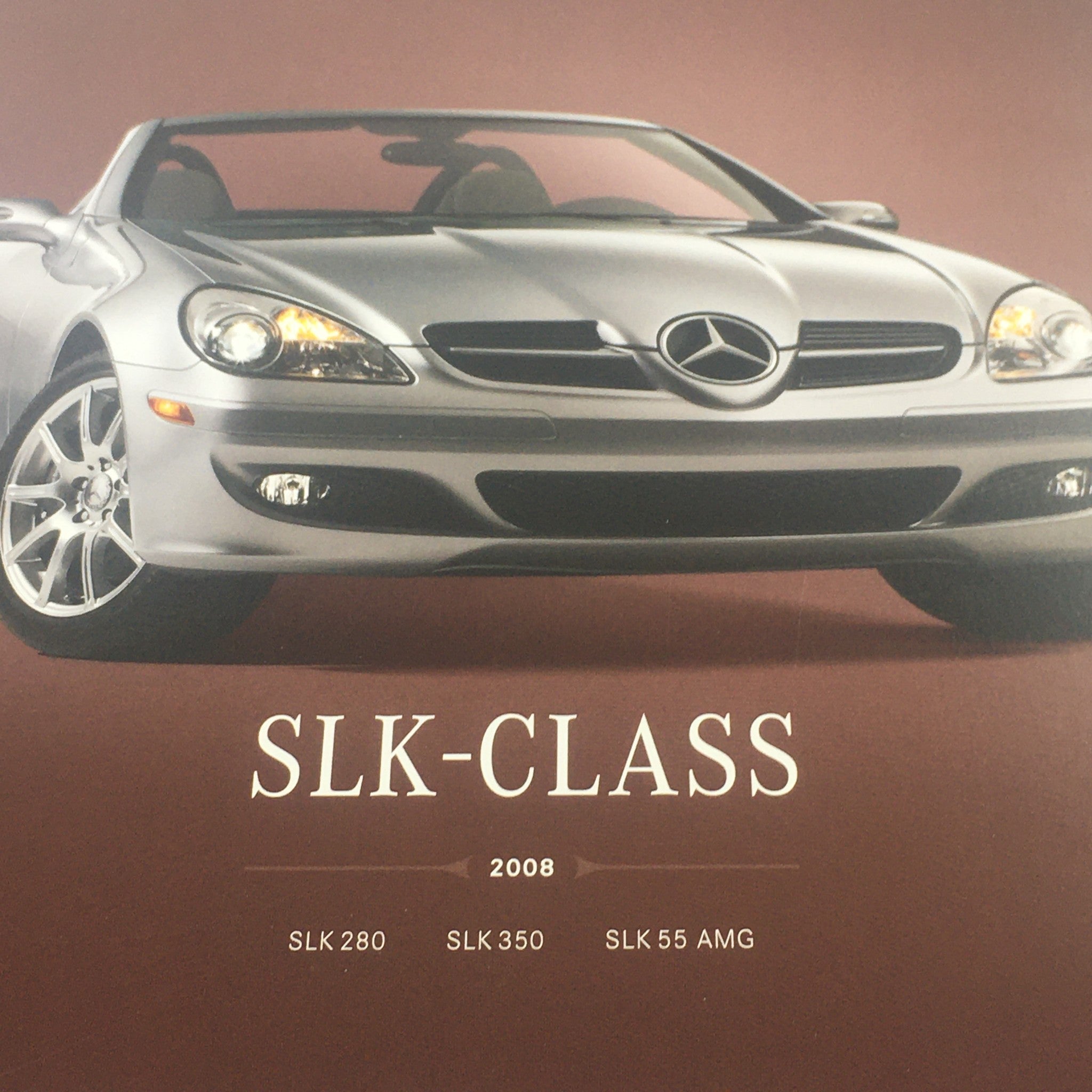 Detailed view of the 2008 Mercedes-Benz SLK-Class 280-350-55-AMG dealership auto brochure highlighting the car's sporty front end and stylish features.
