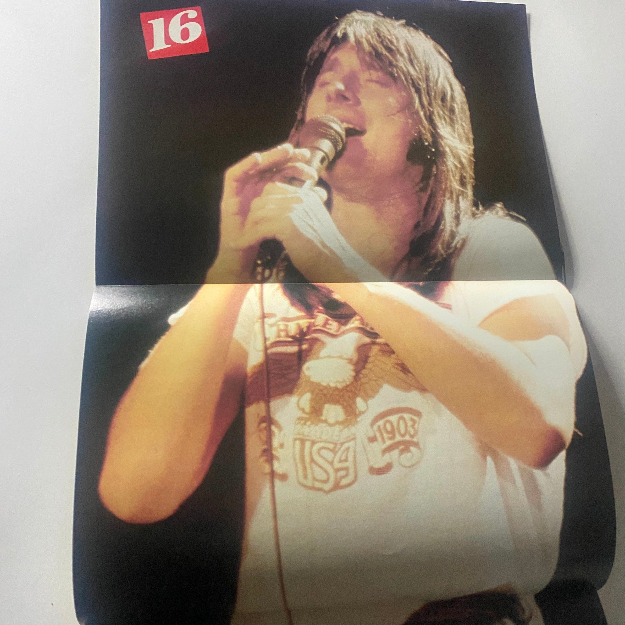 Feature from the July 1982 issue of 16 Magazine showcasing a performance scene with a vocalist, embodying the energetic spirit of the 80s music era.