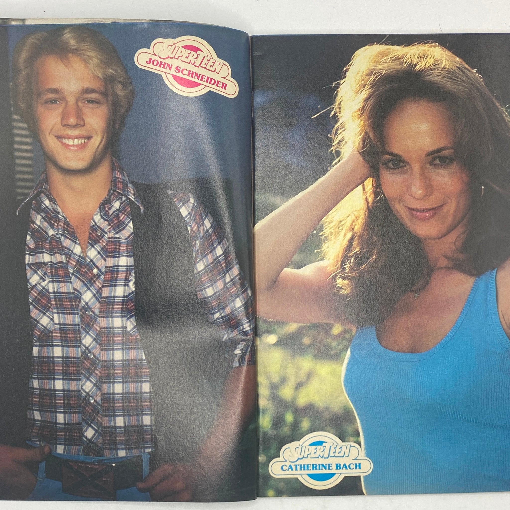 Split page featuring John Schneider and Catherine Bach in the September 1980 issue of SuperTeen Magazine, highlighting popular teen idols of the 1980s.