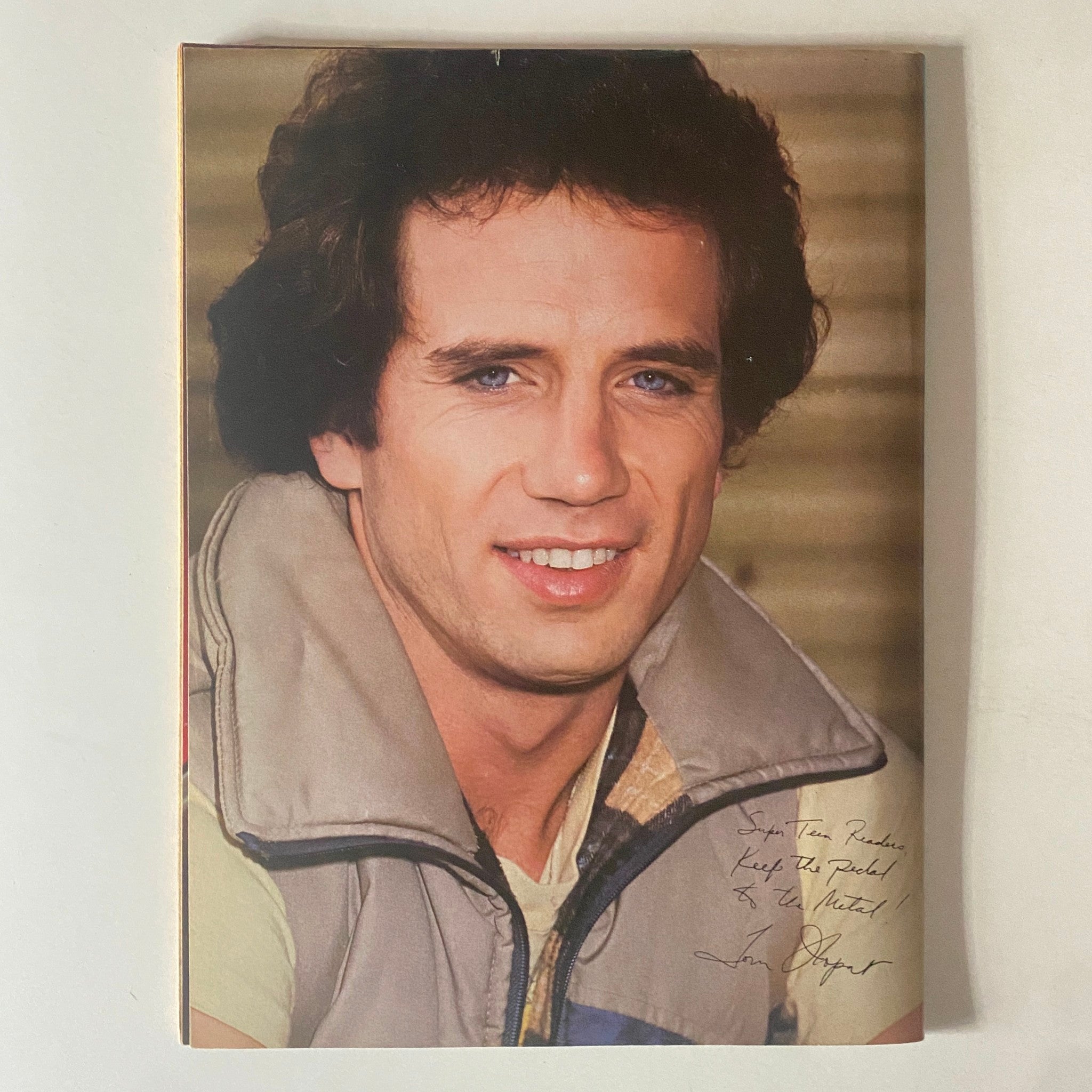 Color photograph of an iconic male star in the September 1980 issue of SuperTeen Magazine, showcasing a classic hairstyle and stylish outfit typical of the 1980s.