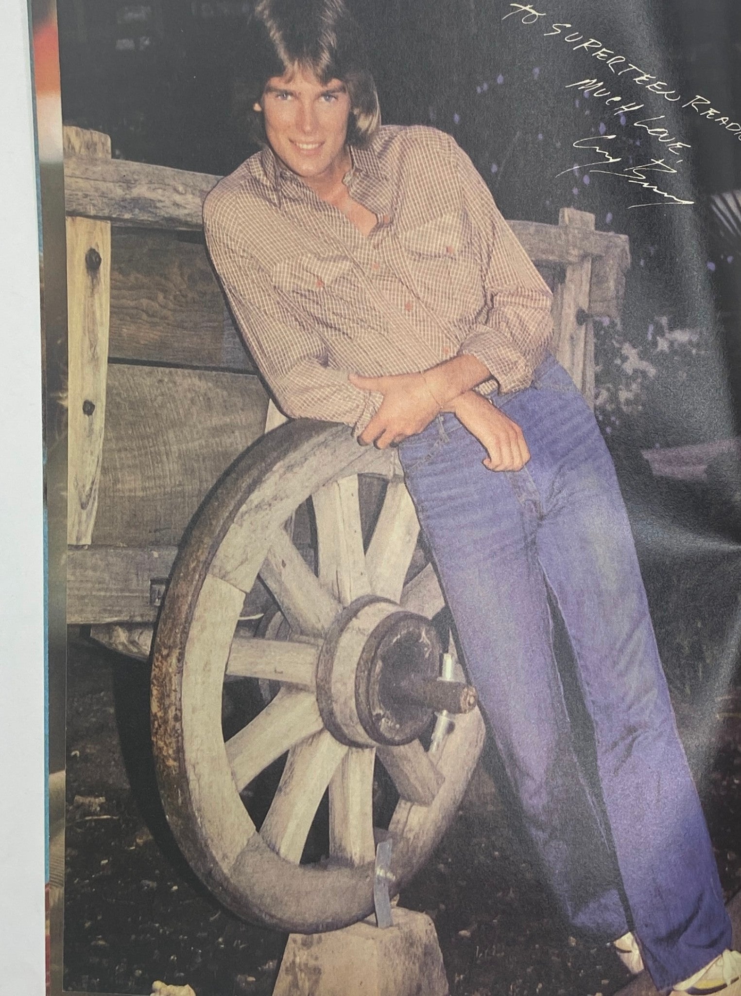 Full-page photo of a young male star leaning on a wagon wheel in SuperTeen Magazine September 1981.