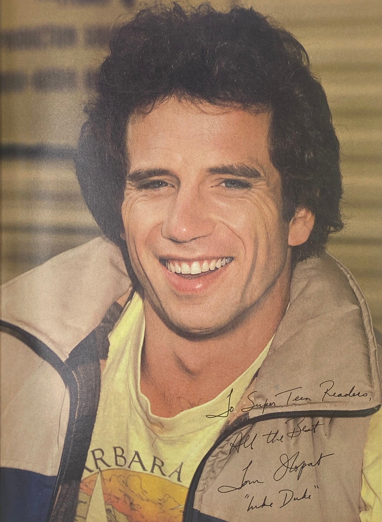 Smiling portrait of a male celebrity in SuperTeen Magazine September 1981, featuring a handwritten note.