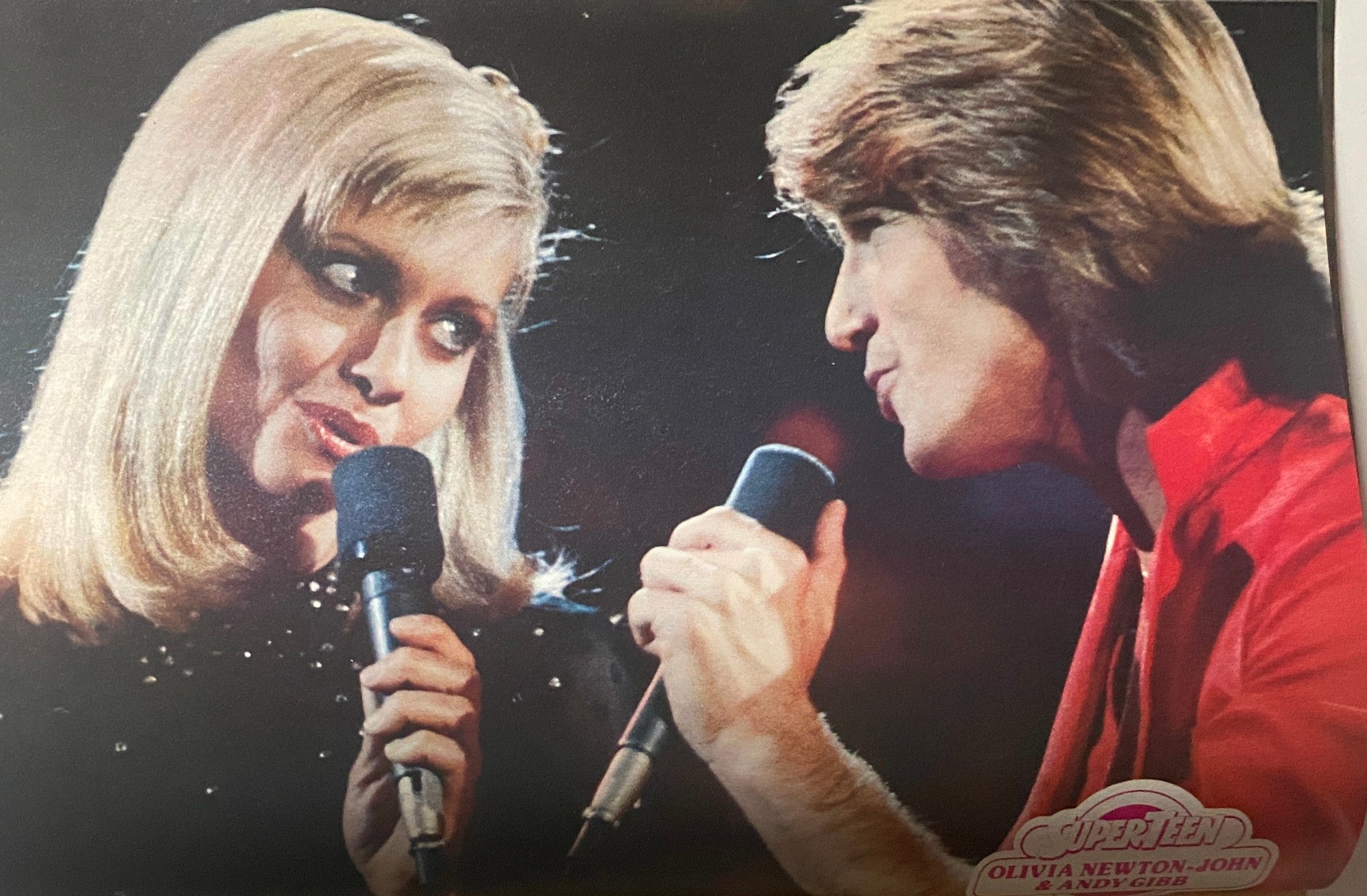 Classic duet performance image of Olivia Newton-John and Andy Gibb featured in SuperTeen Magazine October 1980.