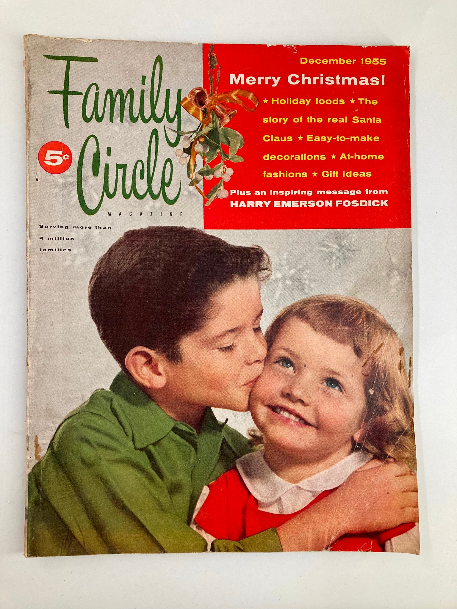 Vintage Family Circle Magazine cover from December 1955 featuring the title "Merry Christmas!" along with the story of the Real Santa Claus, set against a nostalgic holiday background with children.