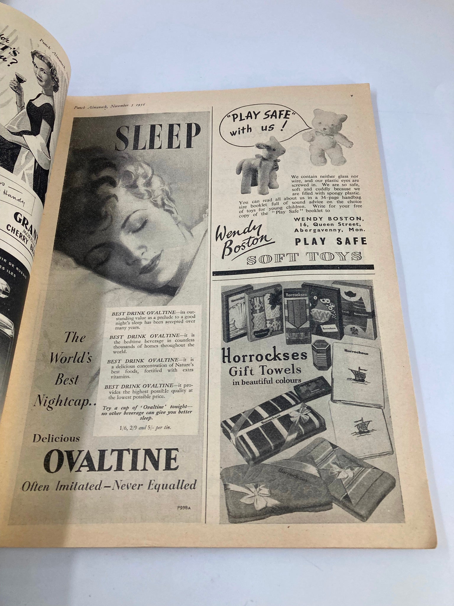 Interior page of VTG Punch Magazine from November 5, 1956 featuring advertisements including Ovaltine and toys, reflecting the mid-20th century culture and lifestyle.