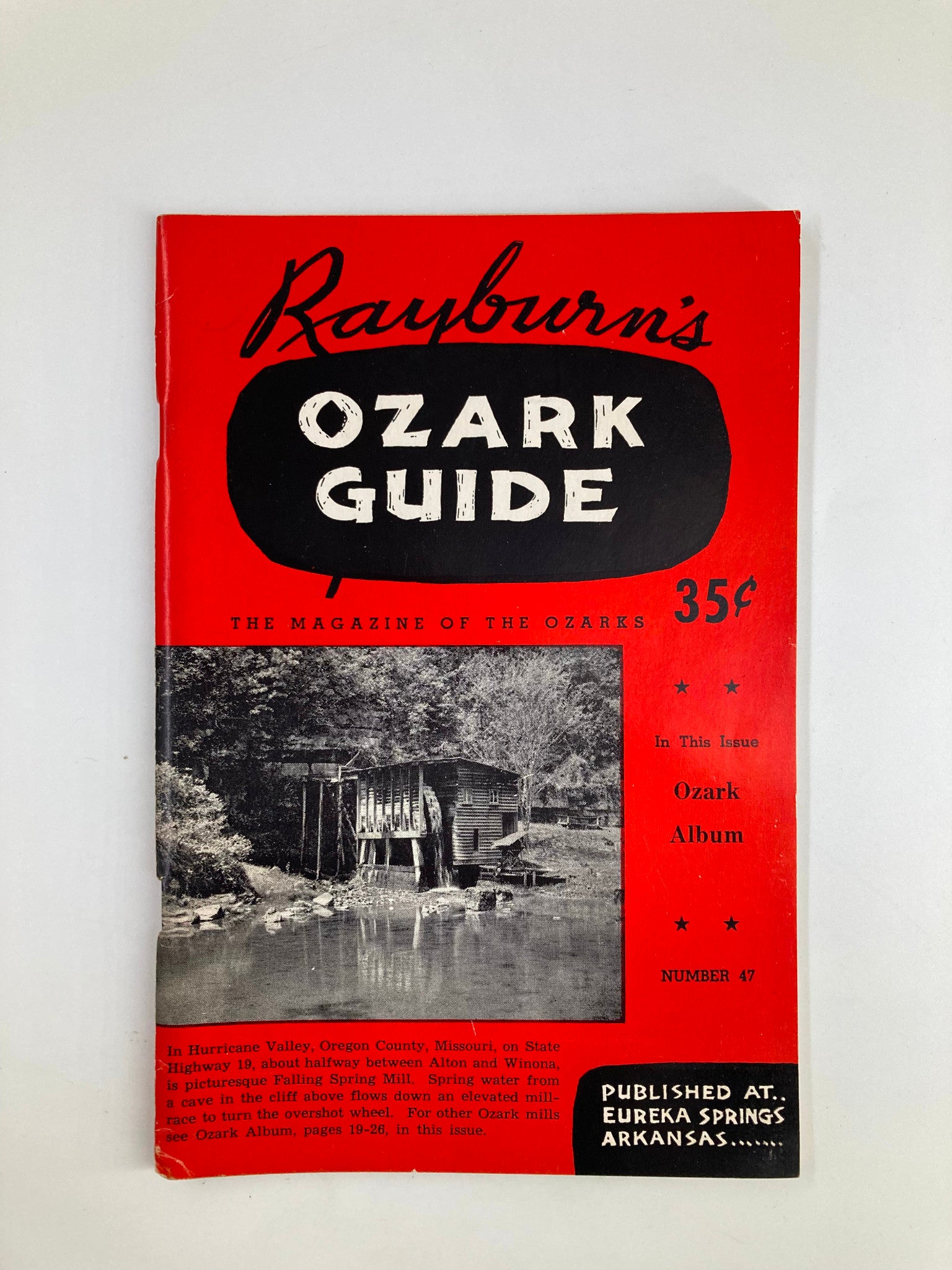 Cover of Rayburn's Ozark Guide Magazine Winter 1957 featuring a scenic black and white image of Falling Spring Mill in Hurricane Valley, Oregon.