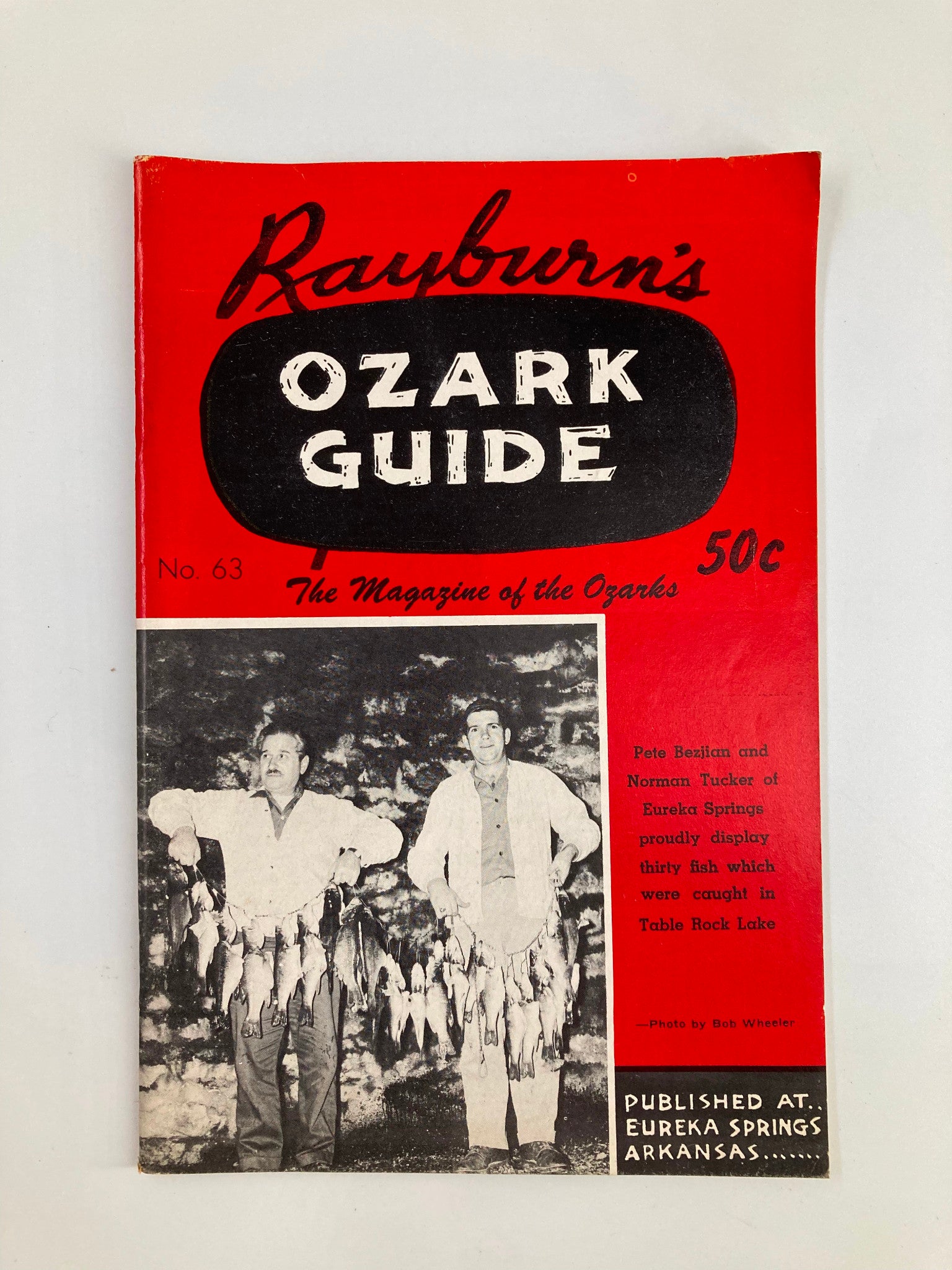 Cover of Rayburn's Ozark Guide Magazine from April 1960, showcasing two men holding fish caught at Table Rock Lake, featuring a striking red layout and vintage design elements.