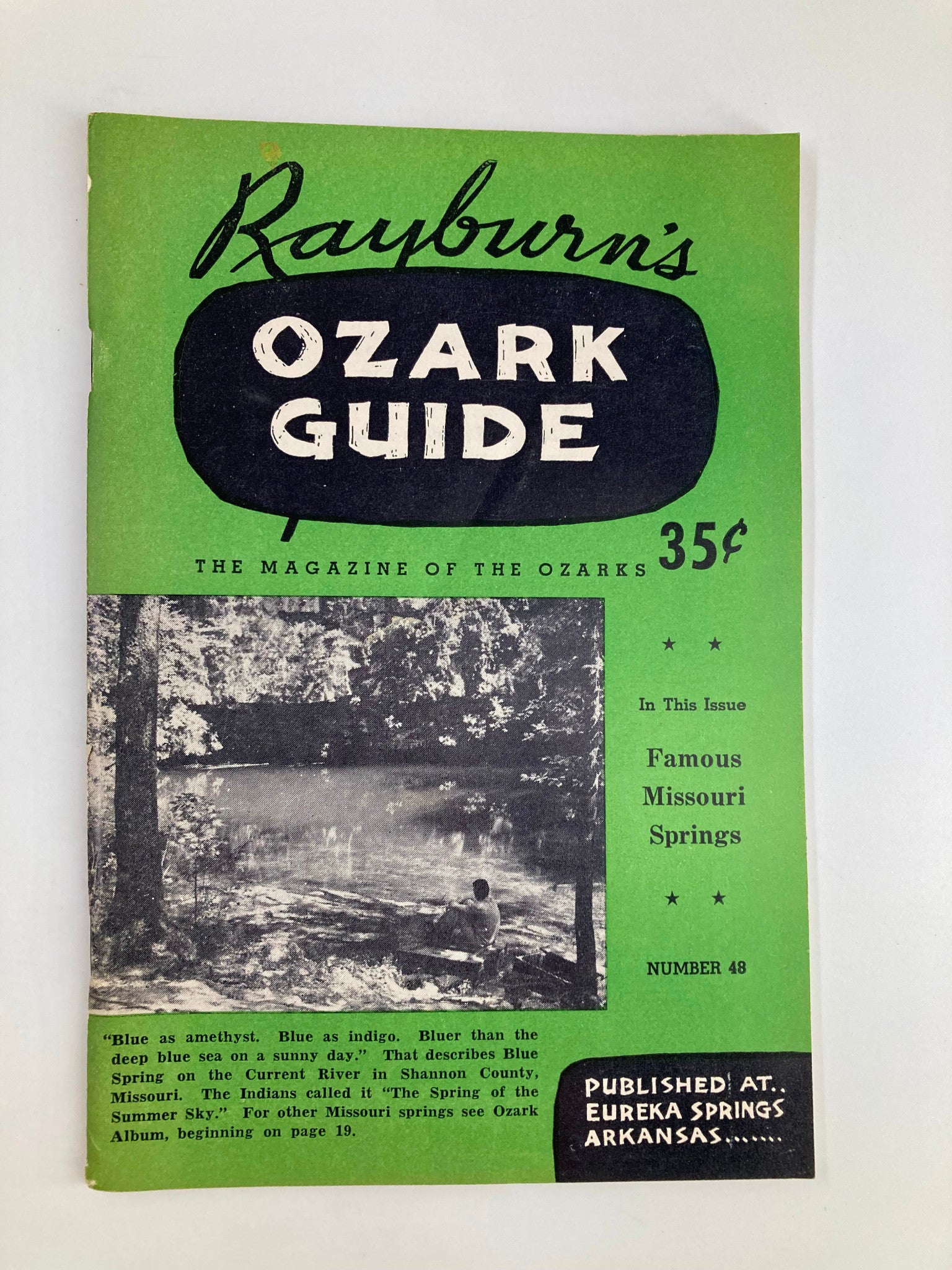 Cover of Rayburn's Ozark Guide Magazine from April 1956 featuring a scenic view of Blue Spring in Shannon County, Missouri, highlighting famous Missouri springs and vintage design elements.