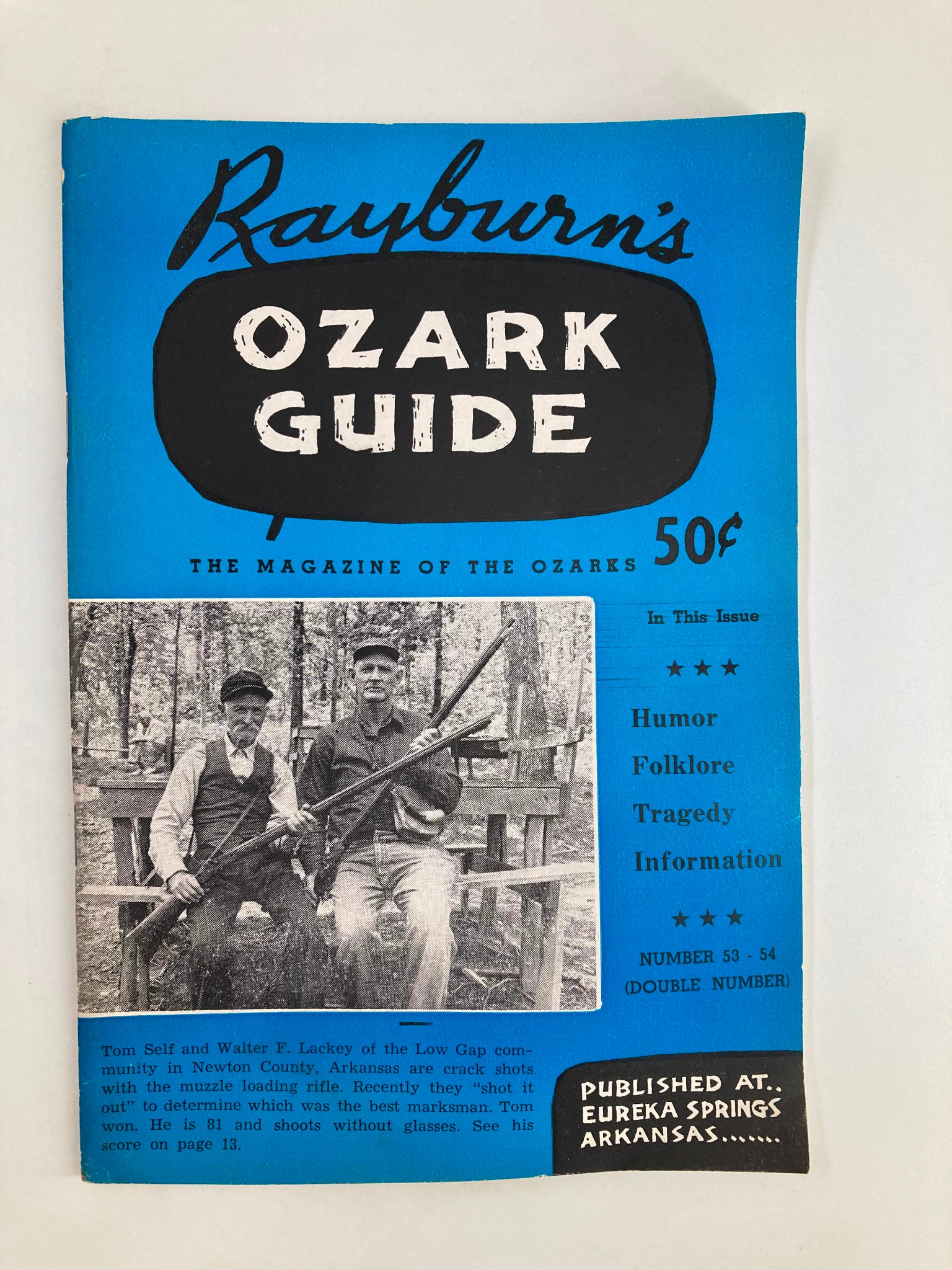 Cover of Rayburn's Ozark Guide Magazine Autumn 1957 featuring Tom Self and Walter F. Lackey, showcasing the title and cover text in vibrant blue.