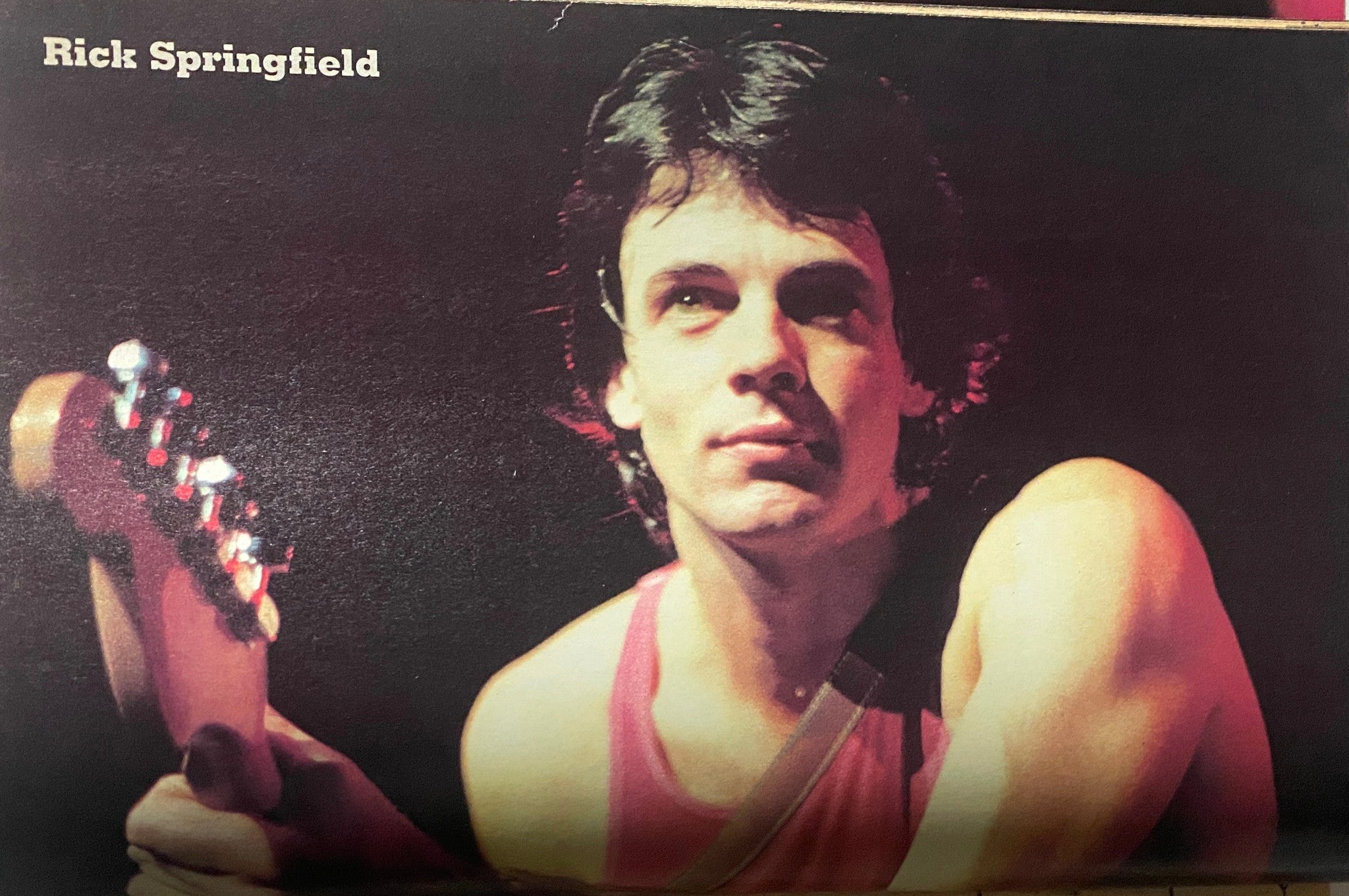 A vibrant image of Rick Springfield featured in 16 Magazine Presents Rock Line Summer 1982, capturing his iconic rock star presence.