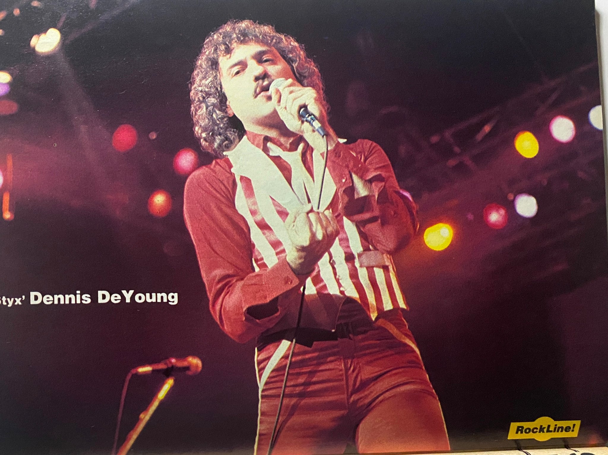 Dennis DeYoung of Styx performing on stage, as featured in 16 Magazine Presents Rock Line Summer 1982, showcasing his energetic performance.