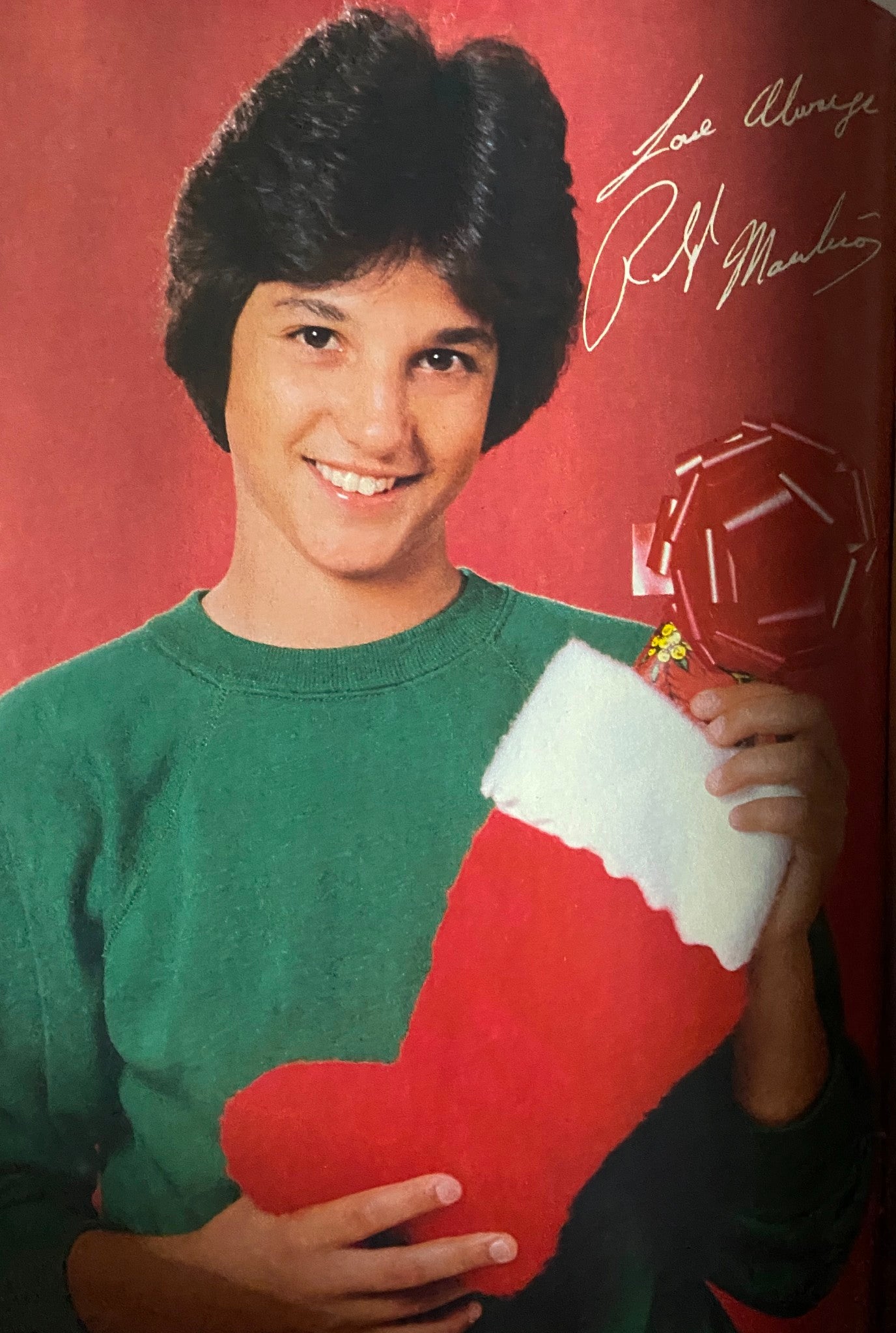 Ralph Macchio featured in a holiday-themed photo from Tiger Beat Magazine January 1982, holding a Christmas stocking.