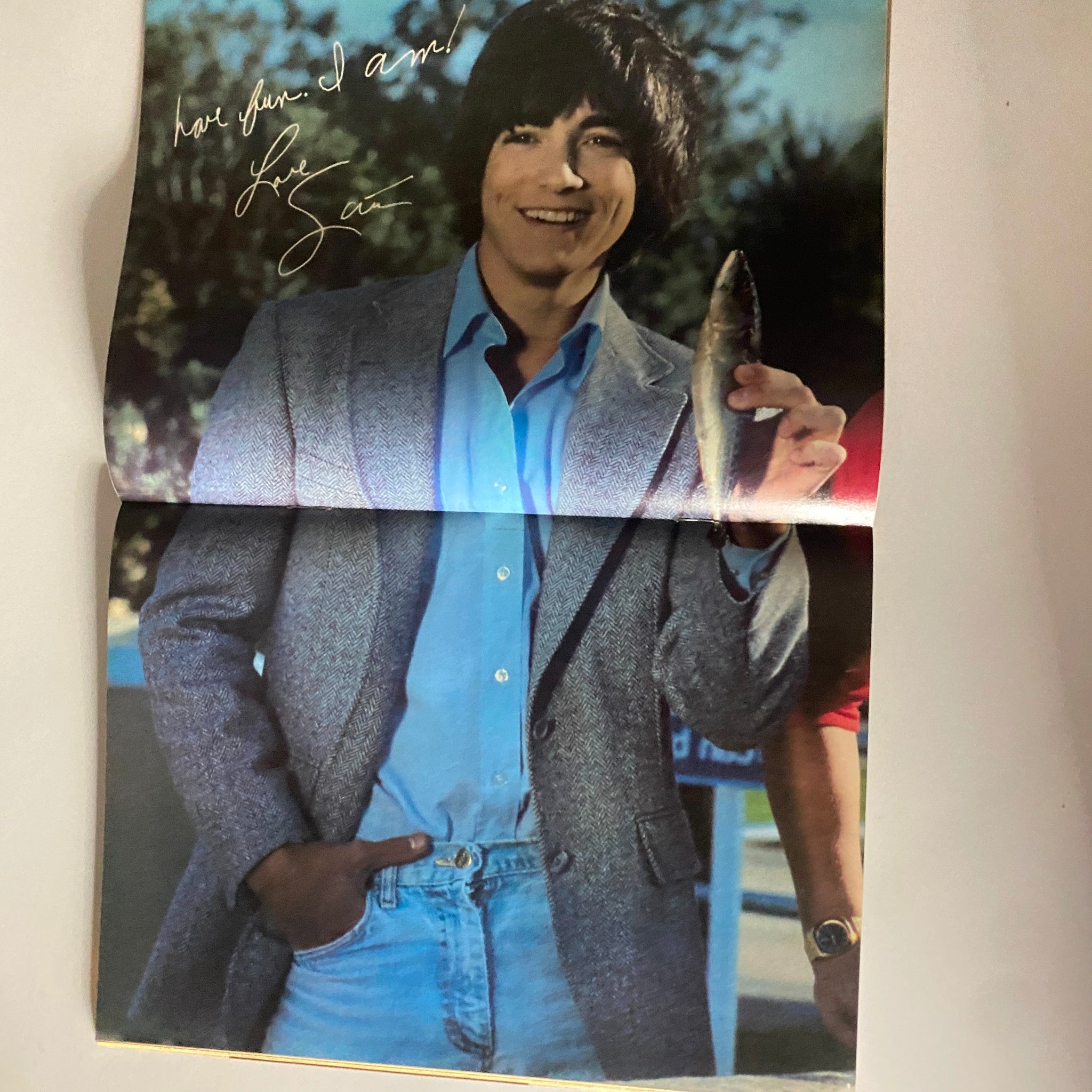 Inside fold-out of Tiger Beat Magazine March 1982 featuring Michael Damian posing with a fish, signed with a handwritten note.