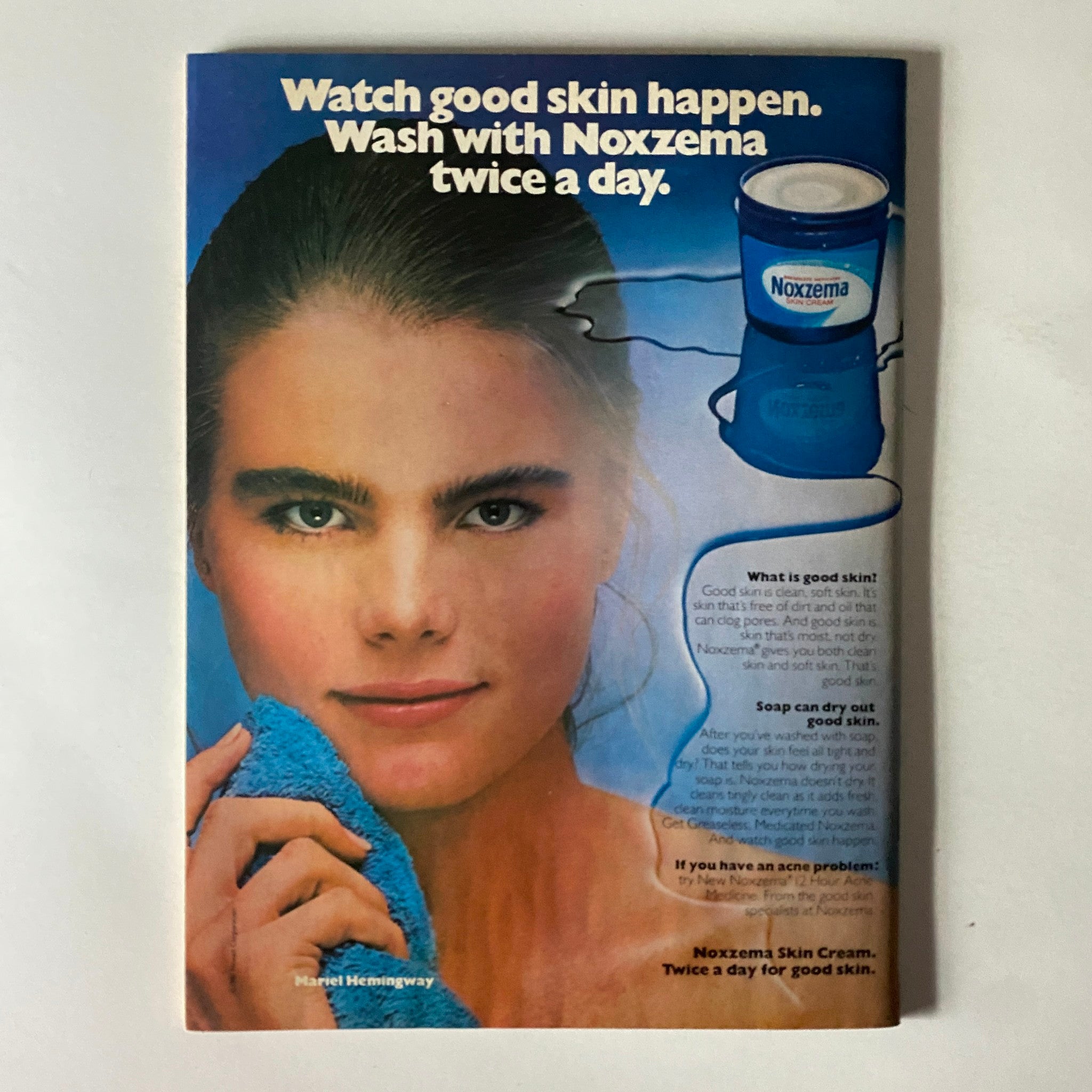 Vintage Noxzema advertisement featuring model Mariel Hemingway promoting good skin care. The ad displays the message 'Watch good skin happen. Wash with Noxzema twice a day,' along with an image of a Noxzema skin cream container and tips about skincare.