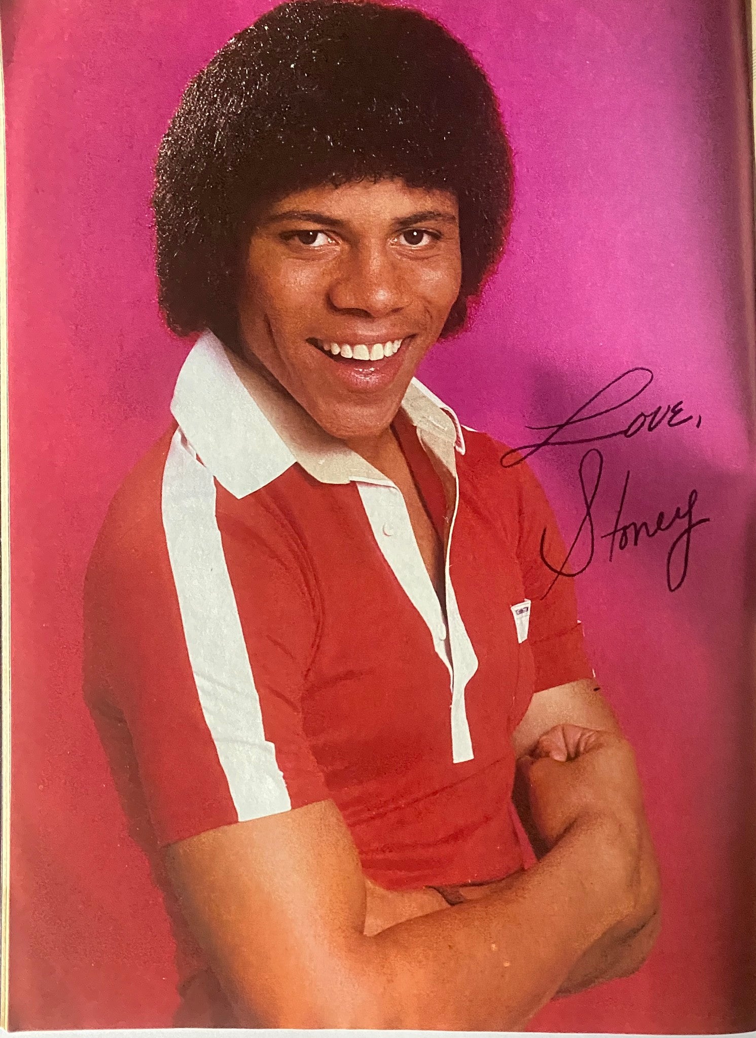 A stylish portrait of Stoney Jackson wearing a red shirt, signed with 'Love, Stoney,' from Tiger Beat Magazine May 1981.