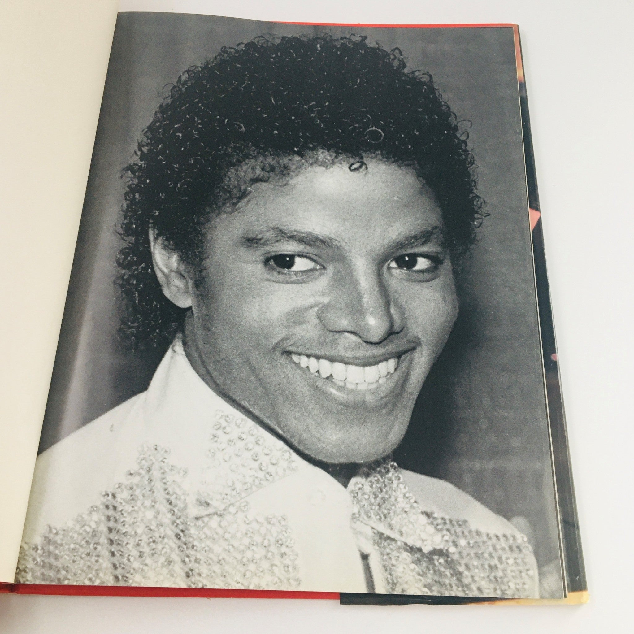Inner page of 'Greenwich House 1984 Presents Michael Jackson' by Stewart Regan showcasing a black and white photo of Michael Jackson.