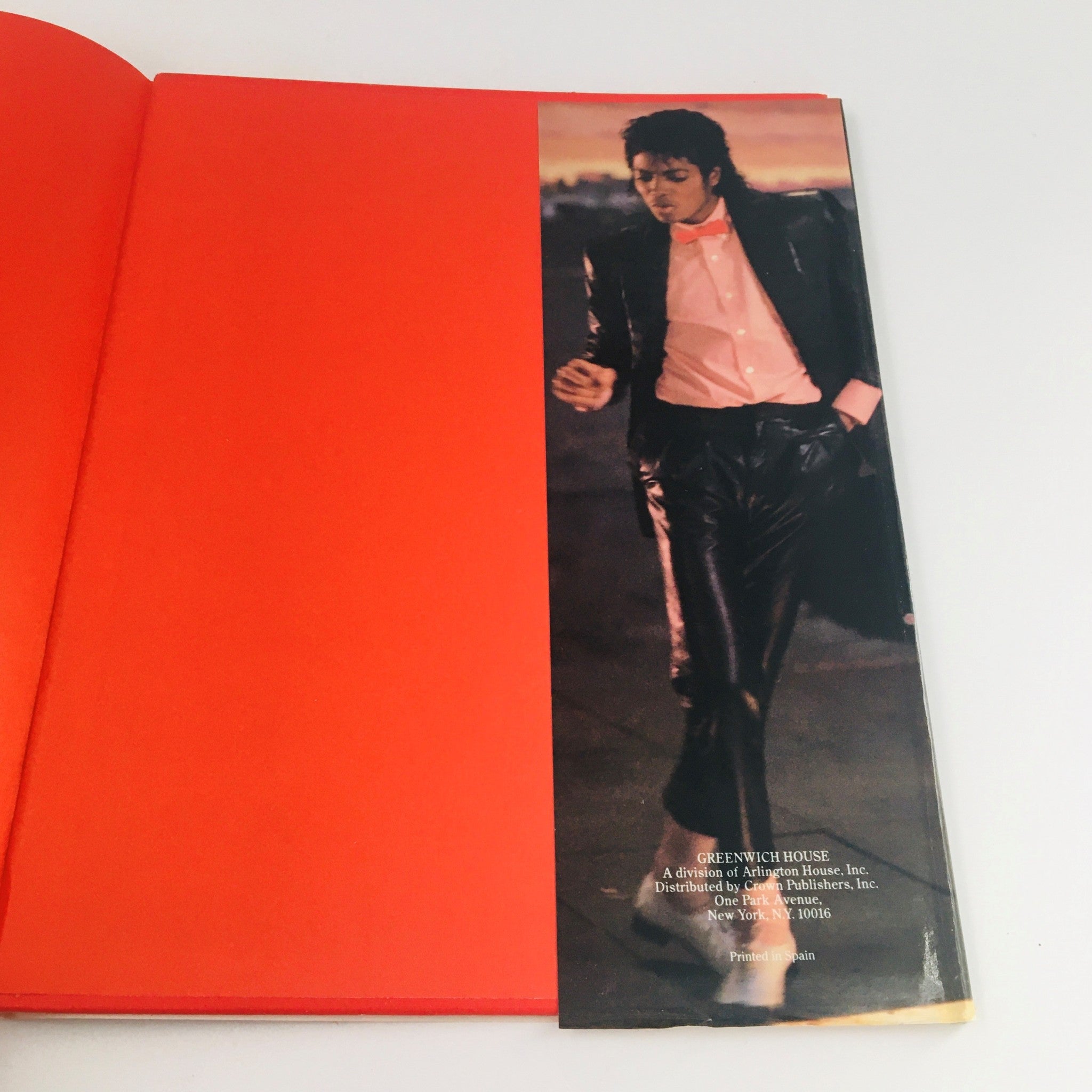 Image of Michael Jackson walking in a stylish outfit, featured in 'Greenwich House 1984 Presents Michael Jackson by Stewart Regan'.