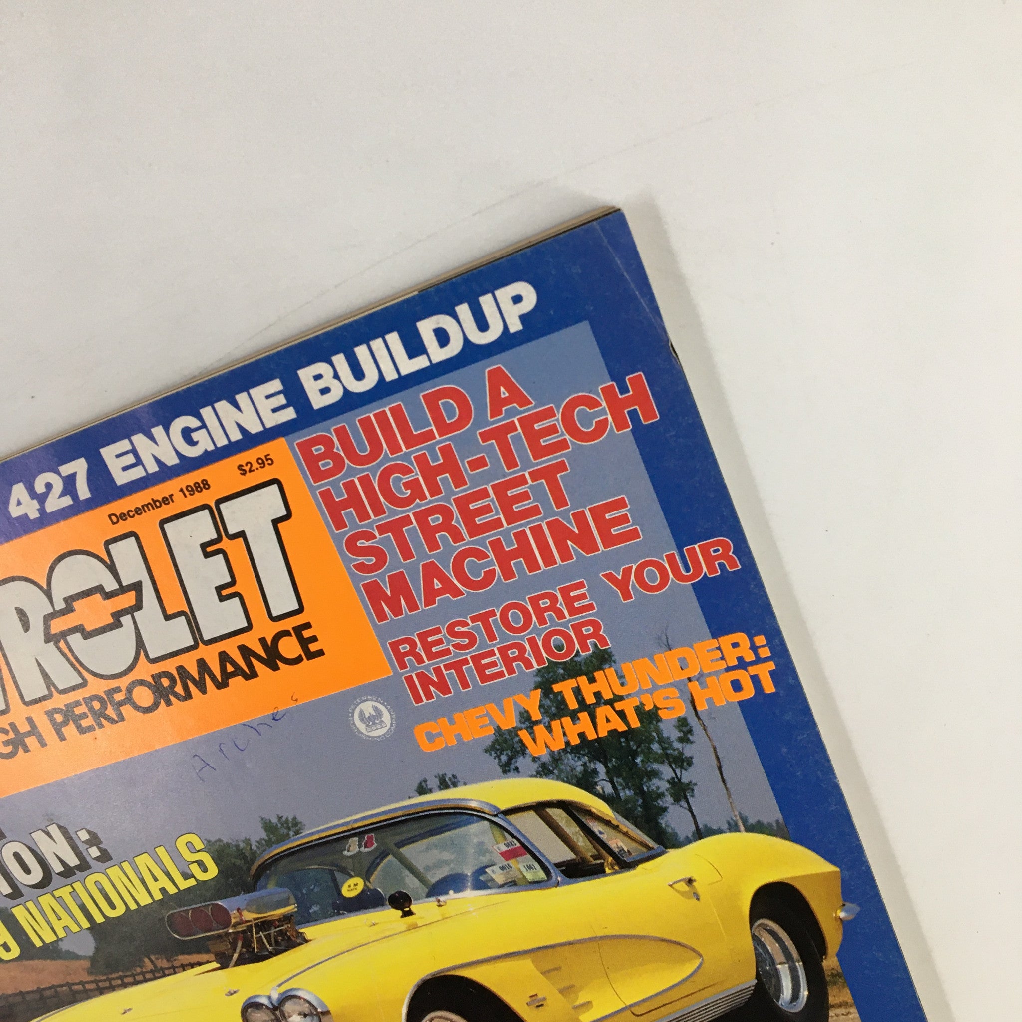 Close-up of the VTG Hot Rod Magazine December 1988 cover, showcasing the title and a yellow Corvette, emphasizing high-performance automotive features.