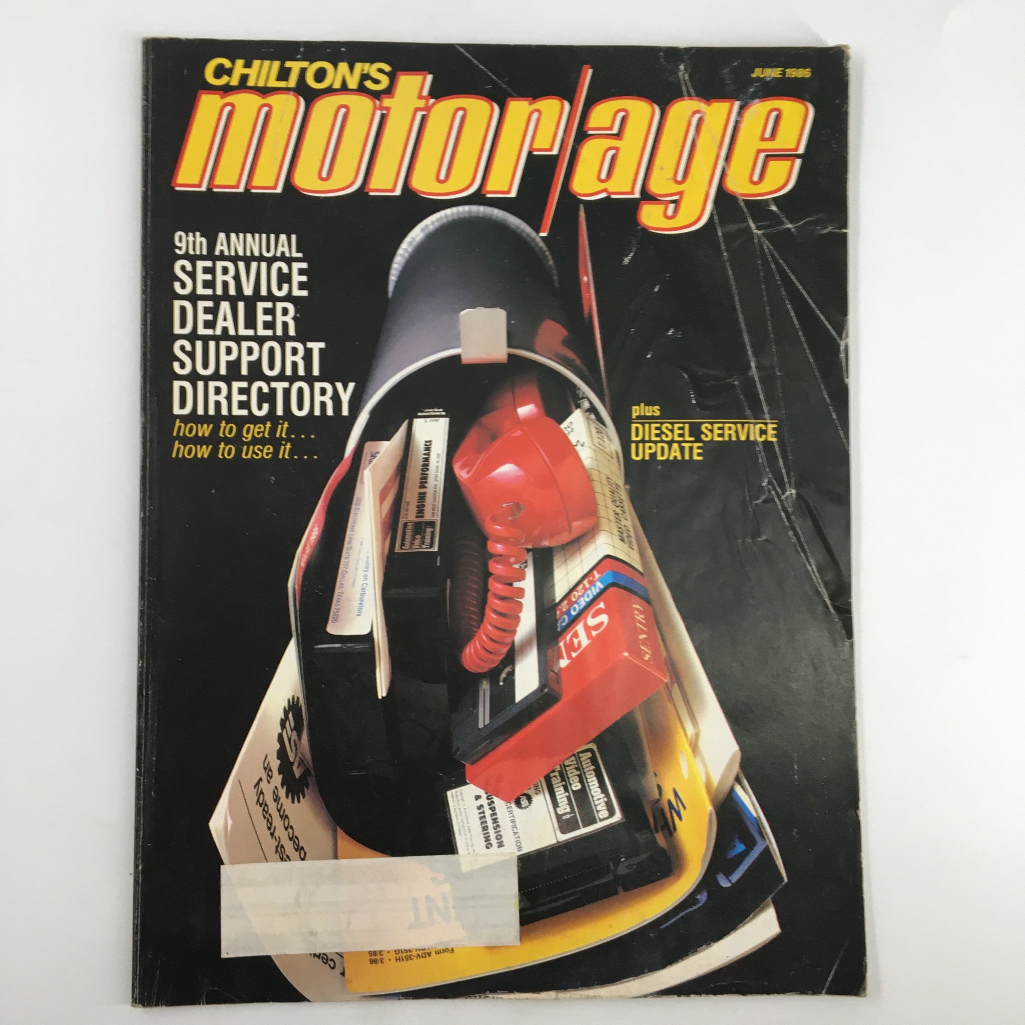 Cover of VTG Chilton's Motor Age Magazine June 1986 featuring the 9th Annual Service Dealer Support Directory, highlighting automotive service resources and a red telephone, ideal for collectors and automotive enthusiasts.
