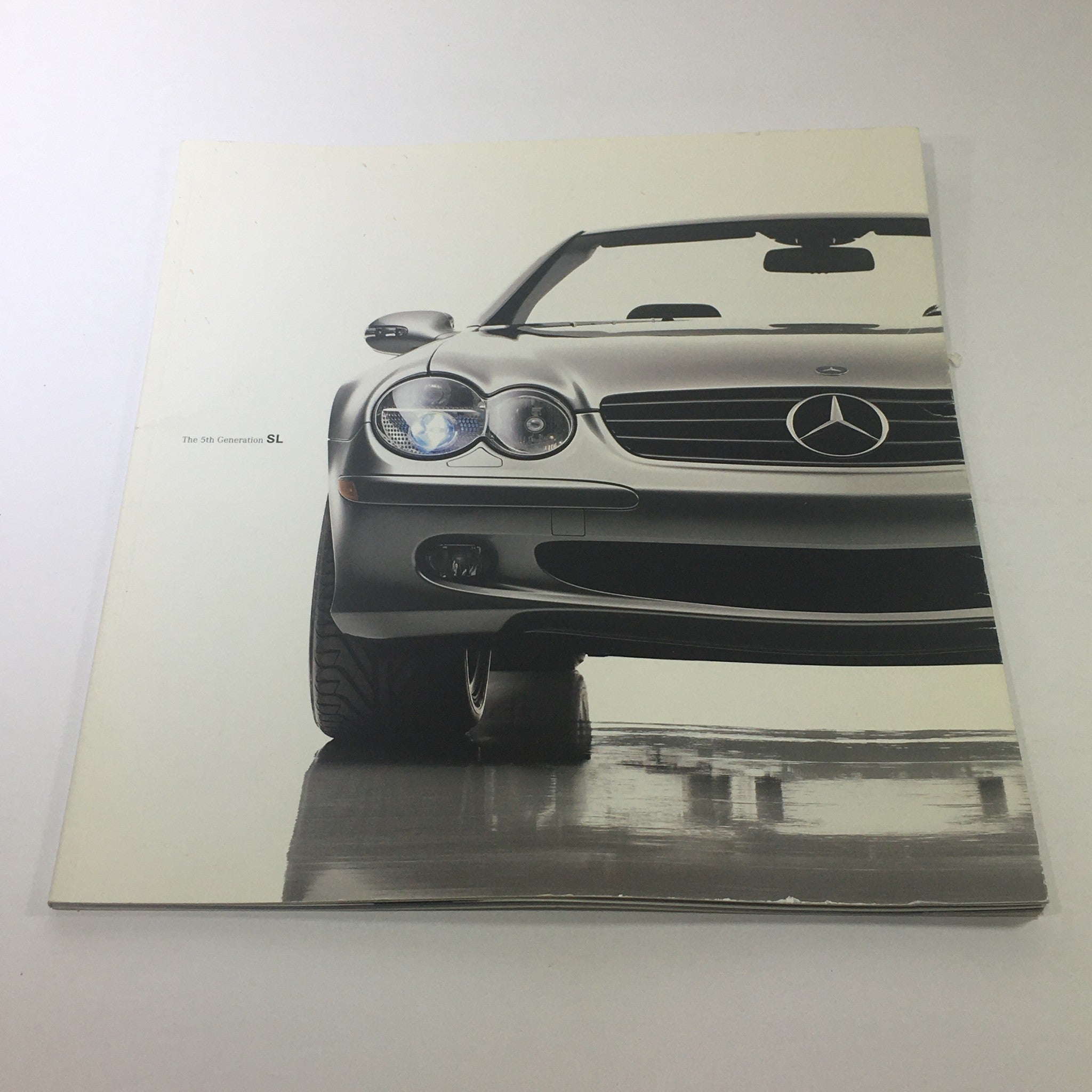 2003 Mercedes-Benz 5th Generation SL-Class Dealership Car Auto Brochure Catalog cover featuring a sleek silver SL-Class in a polished setting.