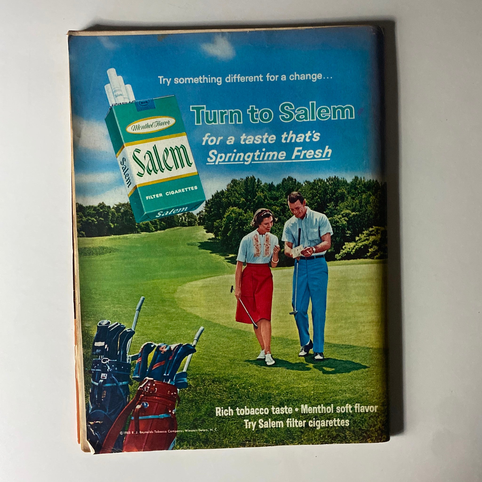 Vintage advertisement for Salem filter cigarettes from a Time Magazine issue dated September 17, 1965 featuring a couple on a golf course, promoting a fresh taste, and highlighting the brand's menthol flavor. The advertisement is relevant to the geopolitical themes presented in the magazine issue covering tensions between Pakistan and India.