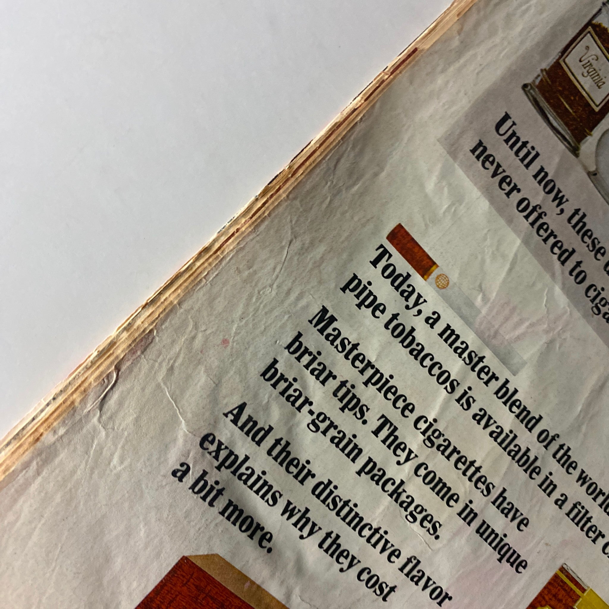Detailed view of an advertisement for Masterpiece cigarettes from Time Magazine August 6, 1965, highlighting the briar tips and distinctive flavor that appeals to smokers.