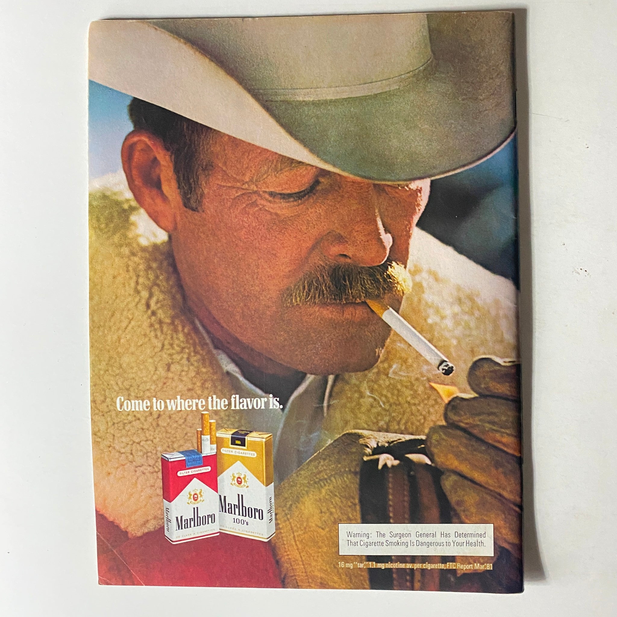 US Magazine January 5, 1982 vintage advertisement for Marlboro cigarettes, showcasing a cowboy with a cigarette against a colorful background.