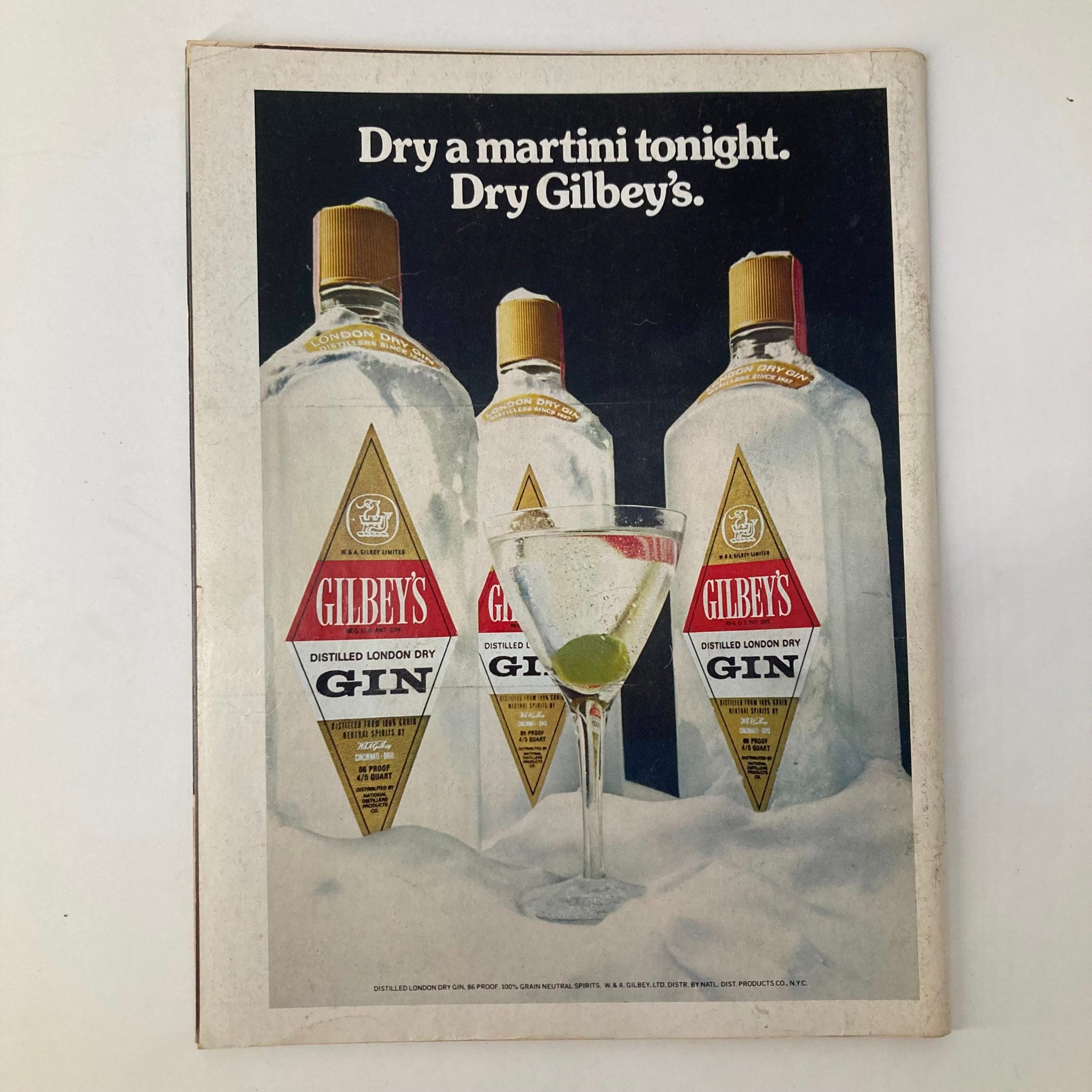 Back cover advertisement of VTG Newsweek Magazine March 17 1975 featuring a promotional image for Gilbey's London Dry Gin with the caption 'Dry a martini tonight. Dry Gilbey's.'