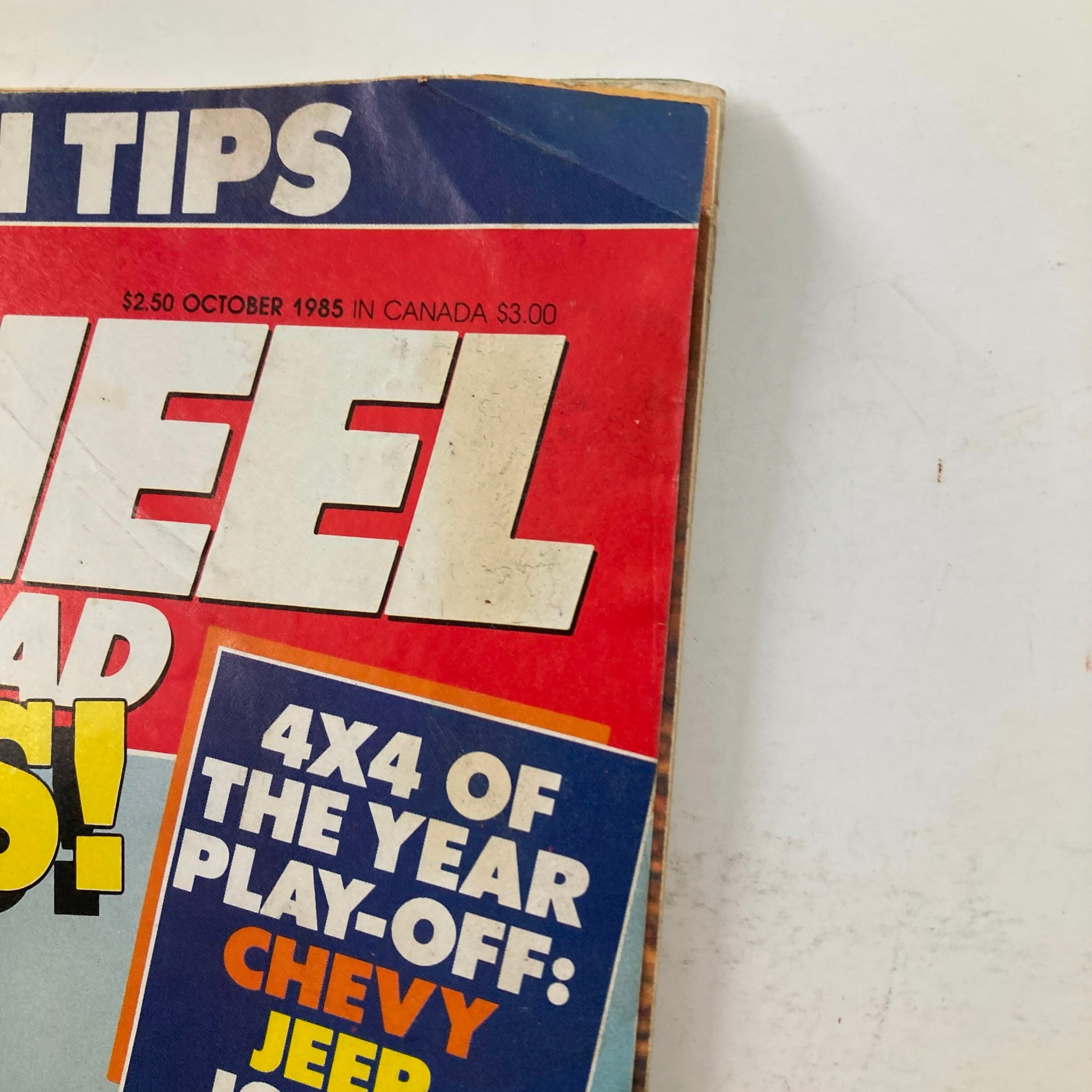 Close-up of the cover of VTG Petersen's 4 Wheel & Off-Road Magazine, October 1985, revealing details of the '4X4 of the Year Play-Off' featuring Chevy, Jeep, and Isuzu.