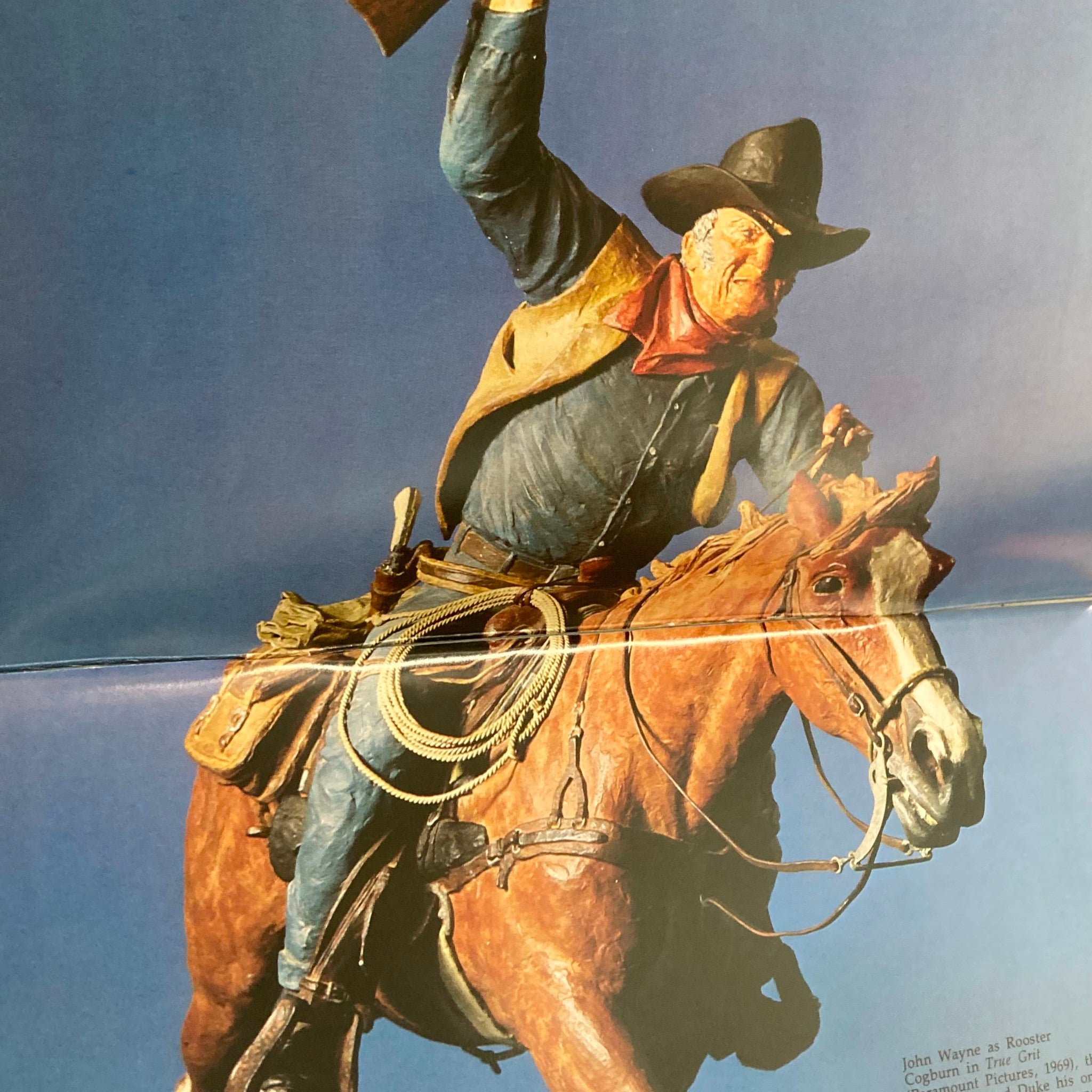 Inside page of the VTG Persimmon Hill Magazine 1979 Vol 9 No. 2 depicting a classic sculpture of John Wayne as Rooster Cogburn from the film True Grit, highlighting Western culture.