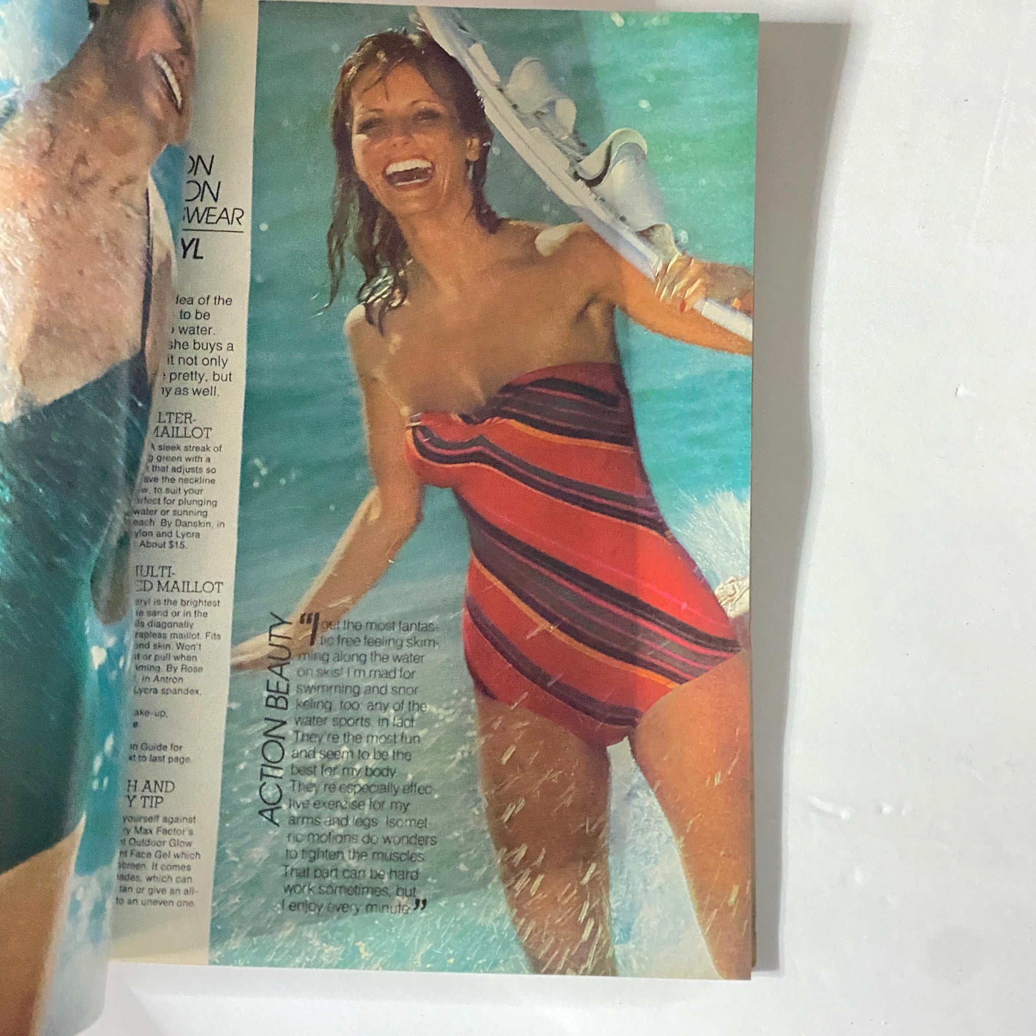 Harper's Bazaar Magazine May 1977 featuring a swimwear model in a striped one-piece suit enjoying a day at the beach, representing 1970s fashion trends.