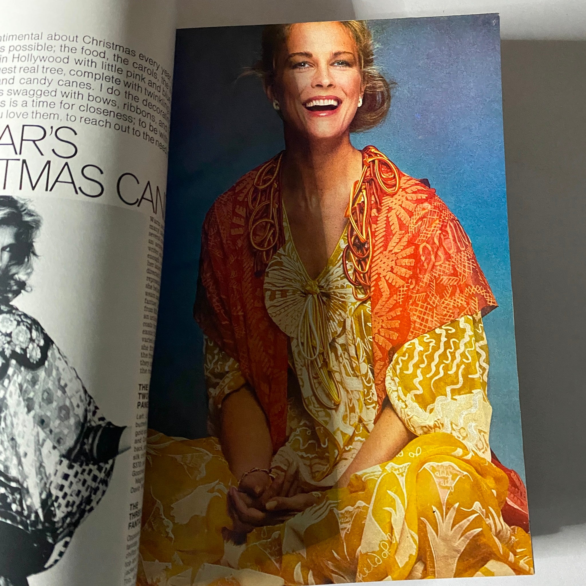 Fashion editorial from Harper's Bazaar Magazine December 1977 showcasing a smiling model wearing festive attire, emphasizing holiday fashion trends.