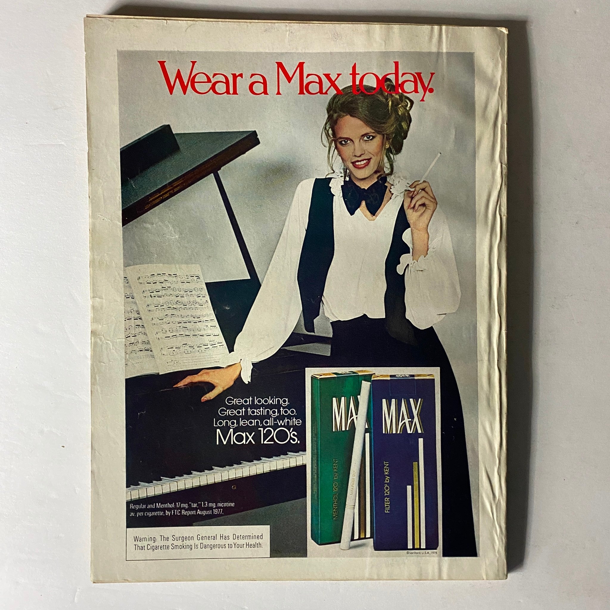 Vintage advertisement in Harper's Bazaar Magazine March 1978 promoting Max cigarettes with a woman in a stylish black and white ensemble.