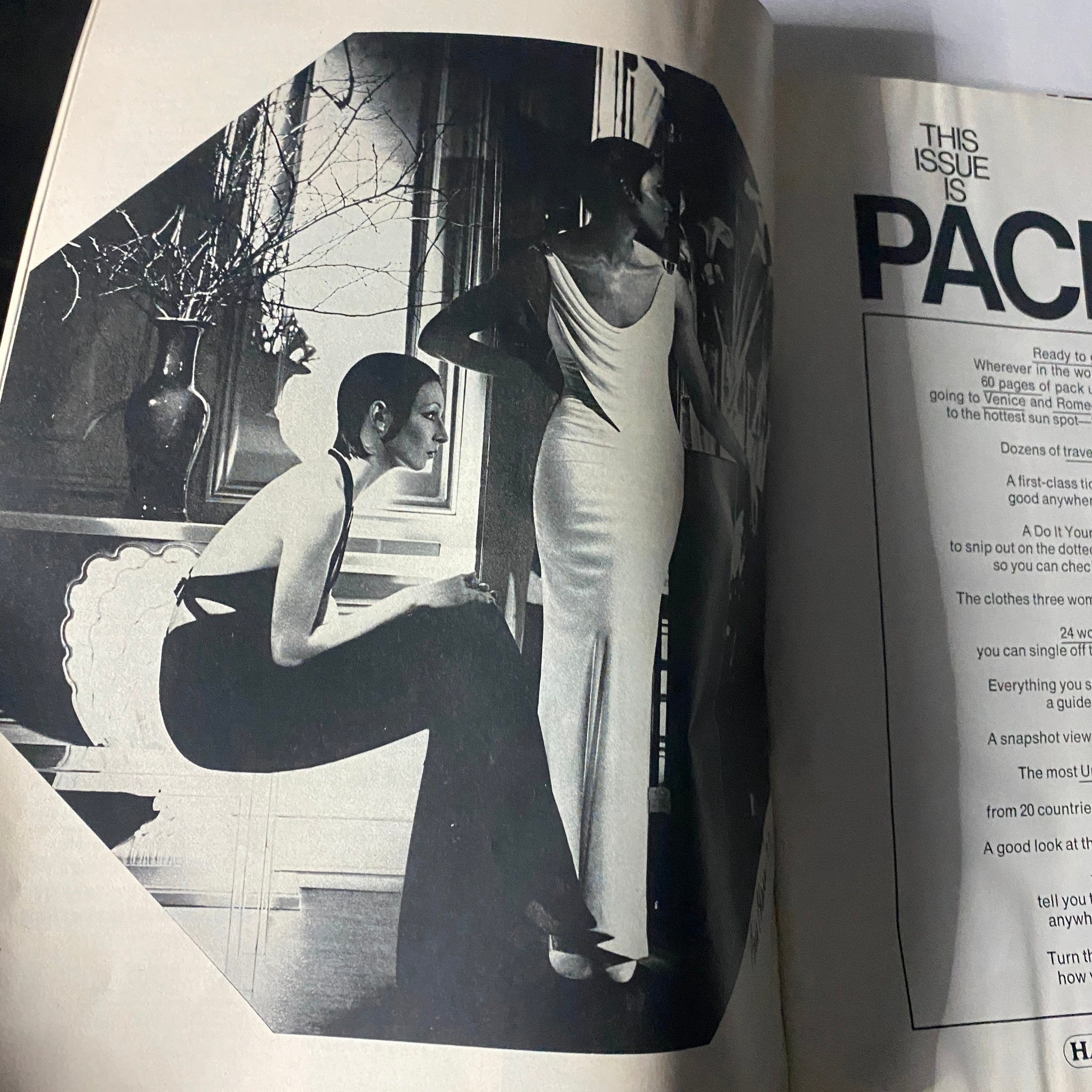 A striking black and white fashion editorial from Harper's Bazaar Magazine, May 1973, featuring two models dressed in chic outfits, embodying the era's style.