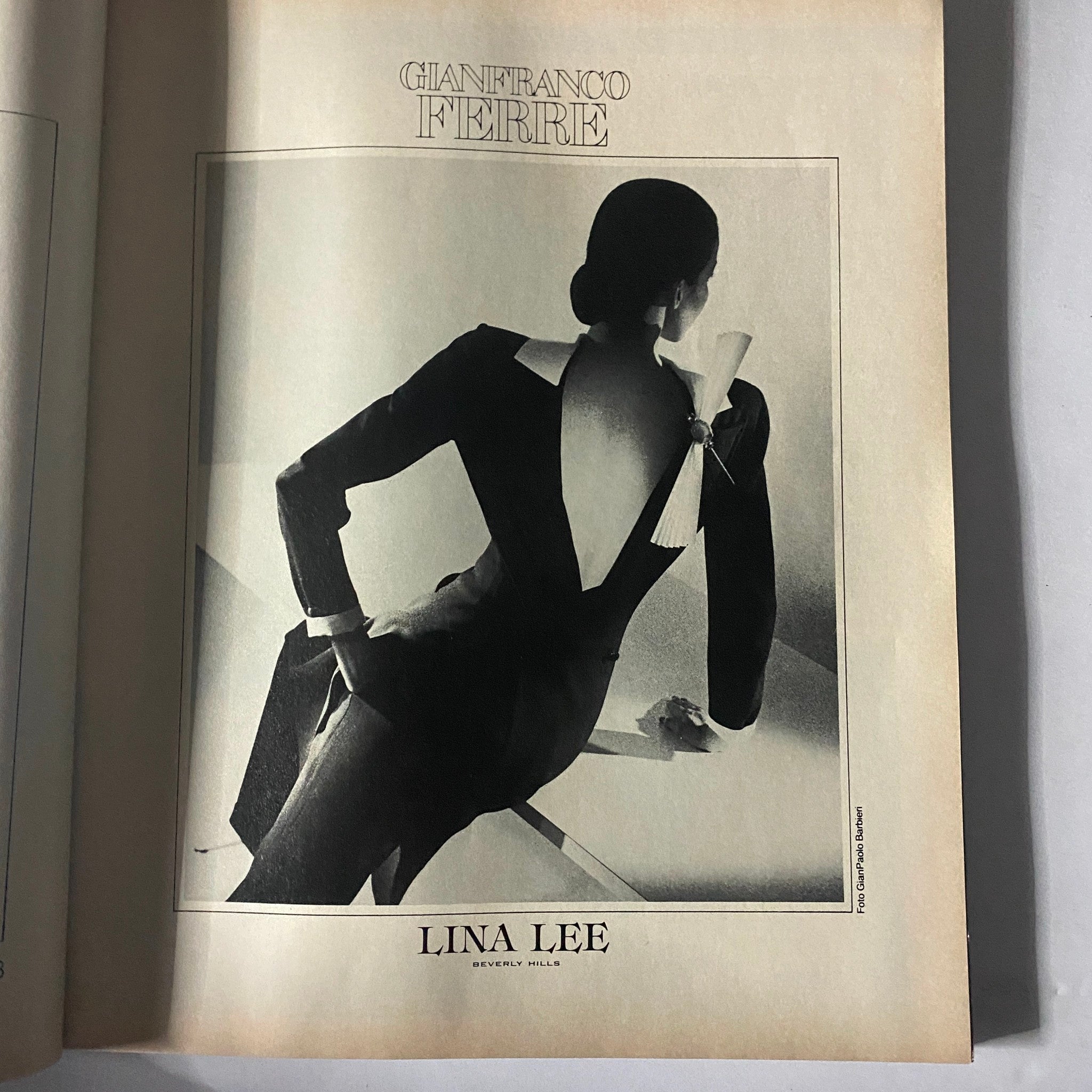 Fashion advertisement featured in Harper's Bazaar September 1980, displaying a chic design by Gianfranco Ferre.