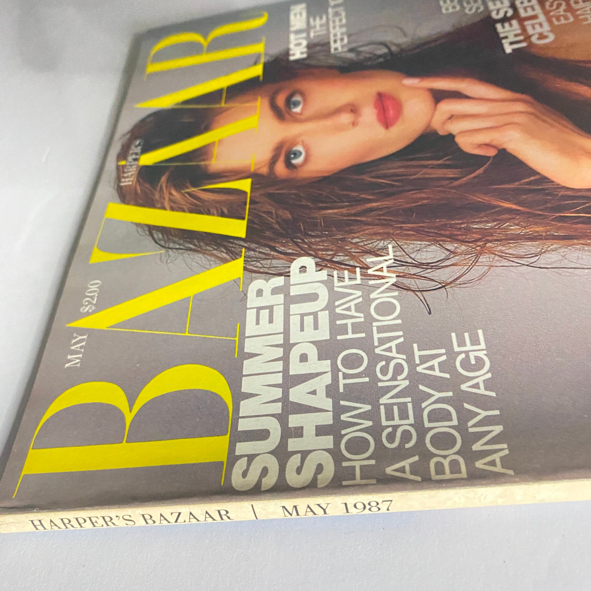 Side view of the May 1987 Harper's Bazaar Magazine, highlighting the cover featuring Paulina Porizkova and the vintage magazine's title.