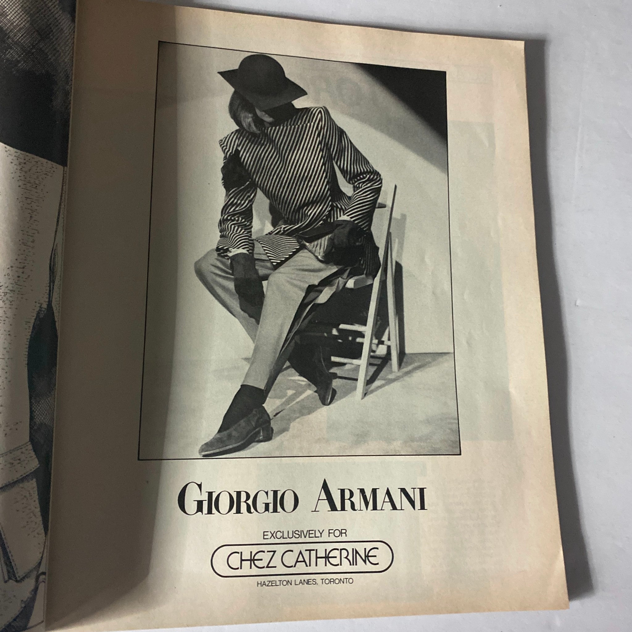 Advertisement featuring a model in a Giorgio Armani outfit from Harper's Bazaar Magazine July 1980.