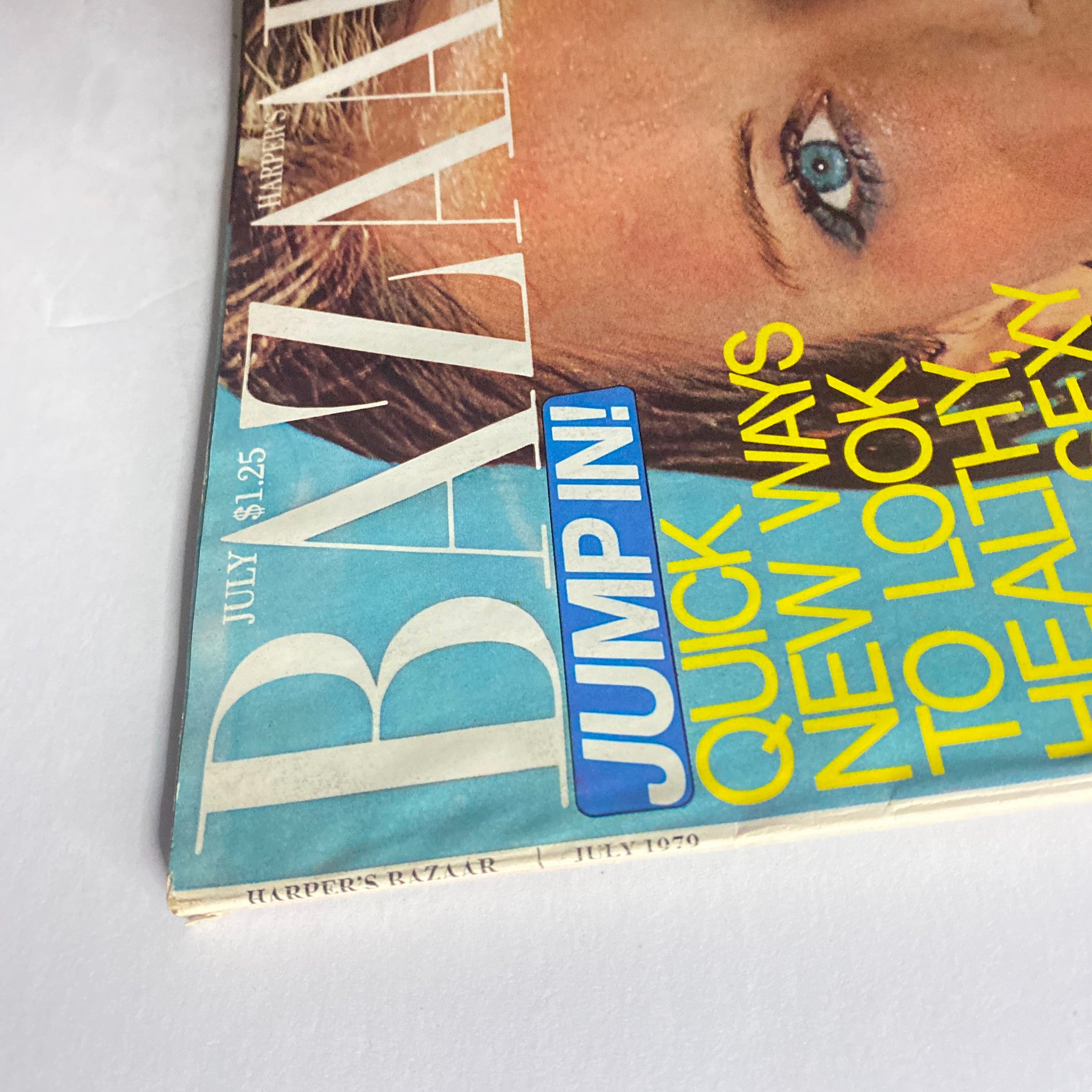 Side view of Harper's Bazaar Magazine July 1979 Cheryl Tiegs Cover emphasizing the magazine's title and date, demonstrating its vintage style.
