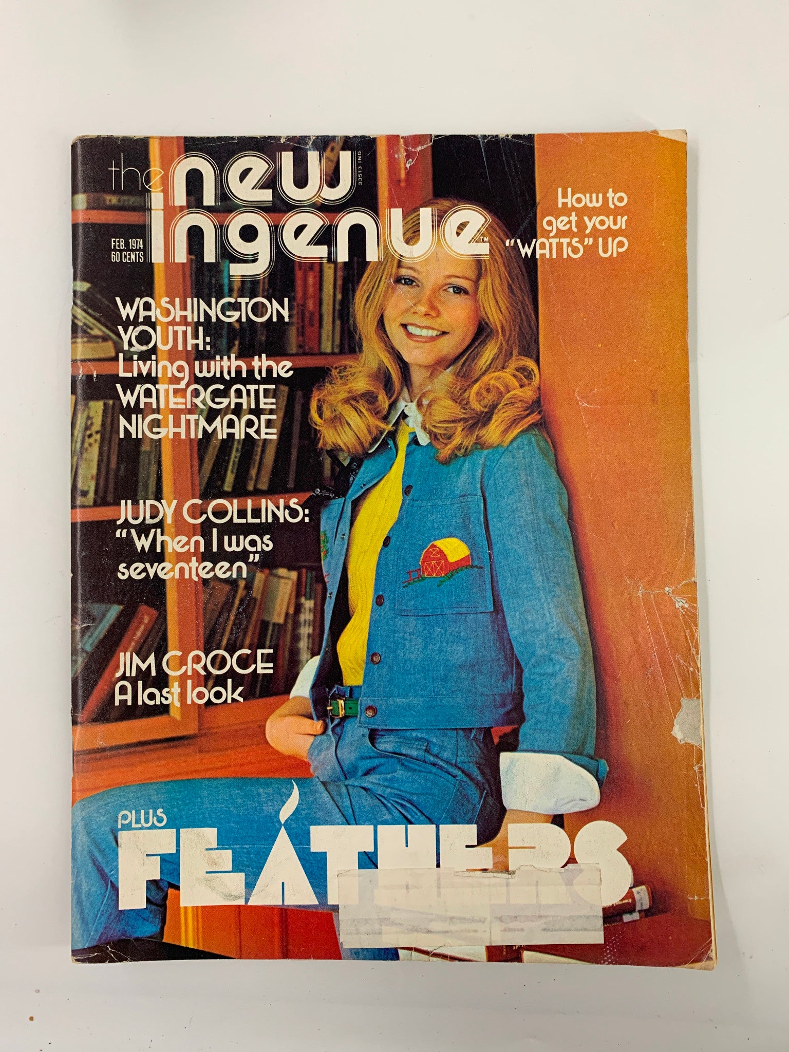 Cover of the VTG New Ingenue Magazine February 1974, featuring Judy Collins and Jim Croce, showcasing a vintage design with a smiling model in a blue outfit and the headline "How to get your 'WATTS' UP".