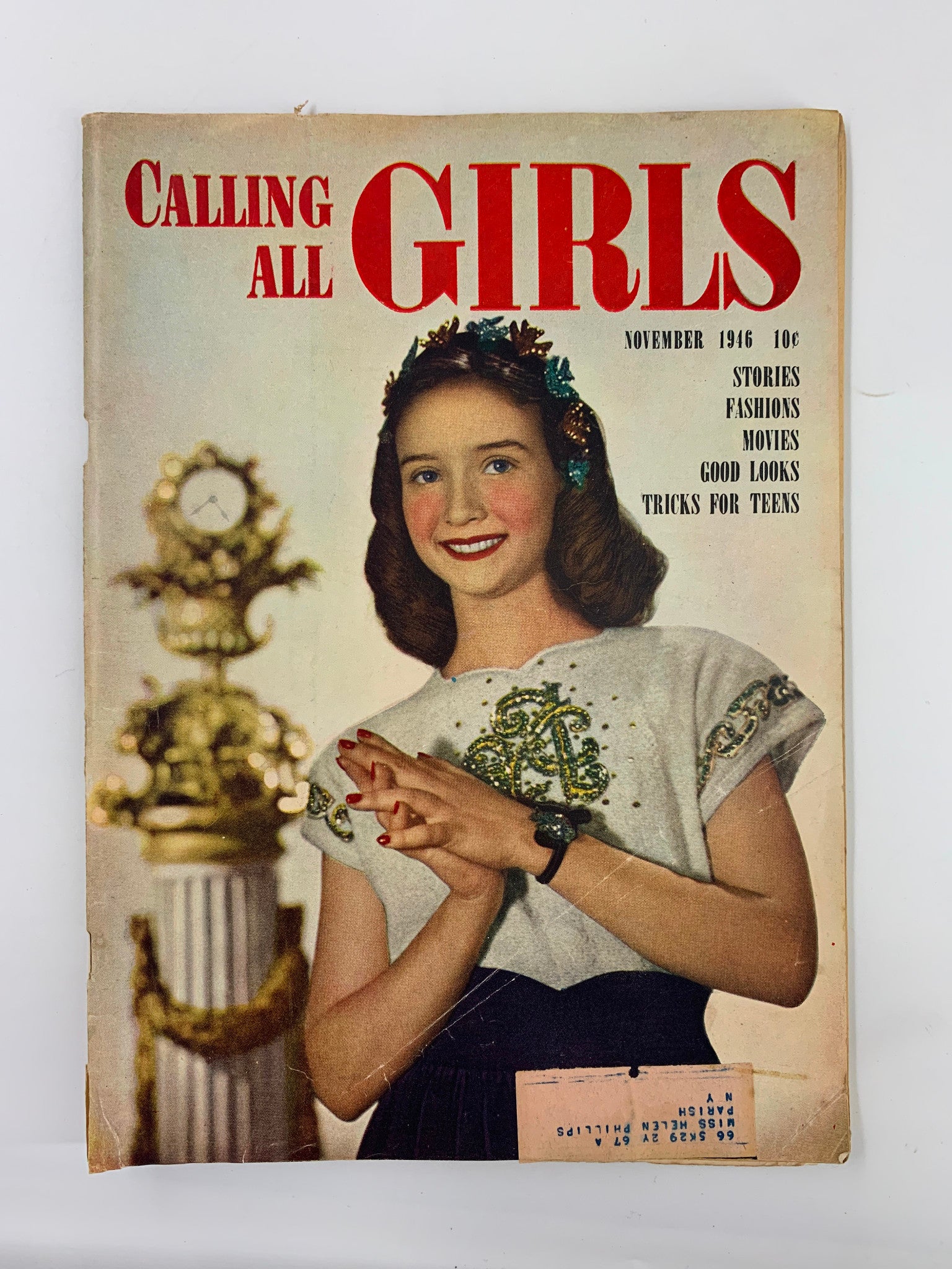 Cover of VTG Calling All Girls Magazine November 1946 featuring a smiling girl with a floral headband, showcasing vintage fashion and the magazine title prominently.