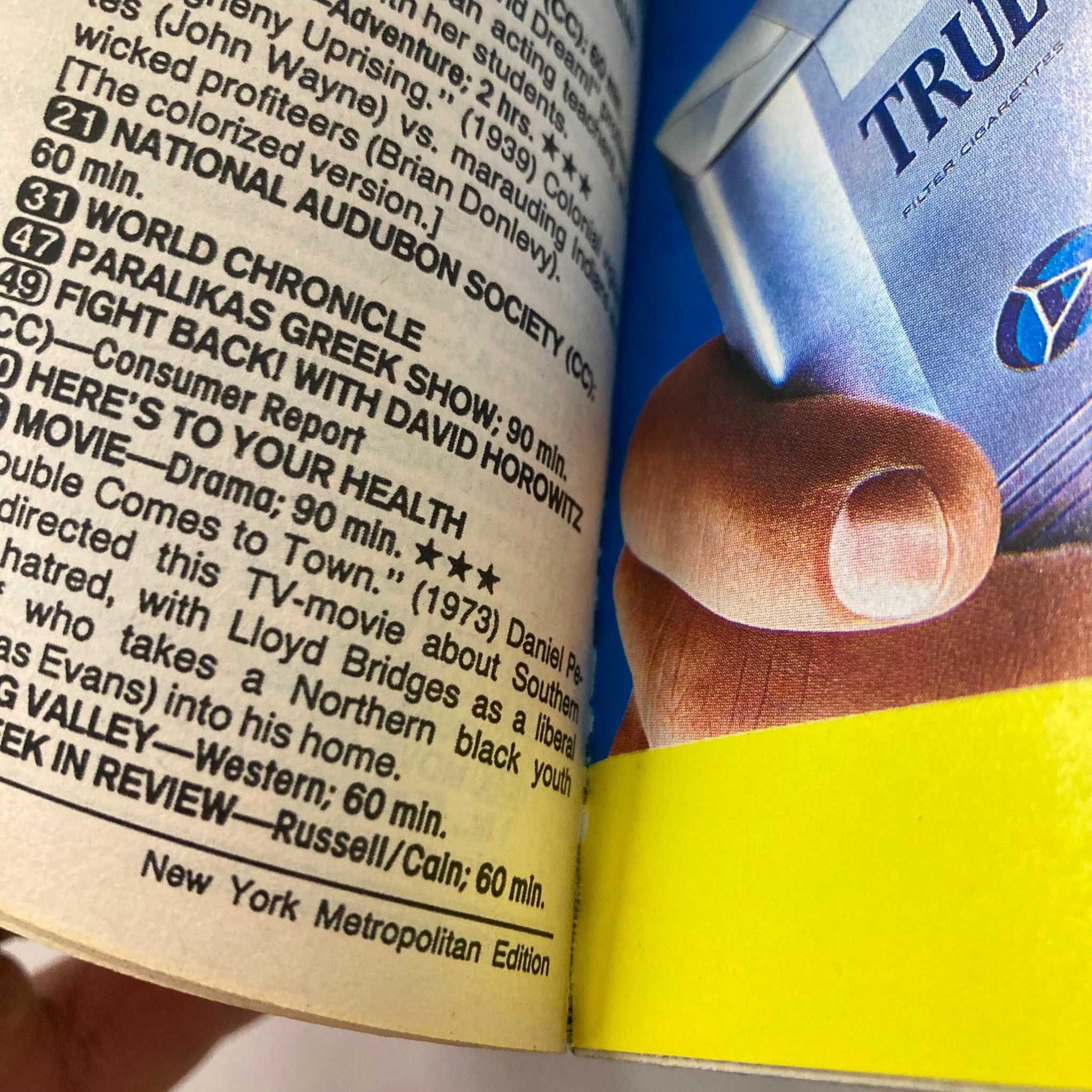 Interior page from TV Guide Magazine July 15 1989 displaying television listings and reviews, with a close-up of a cigarette advertisement, reflecting the media landscape of the era.