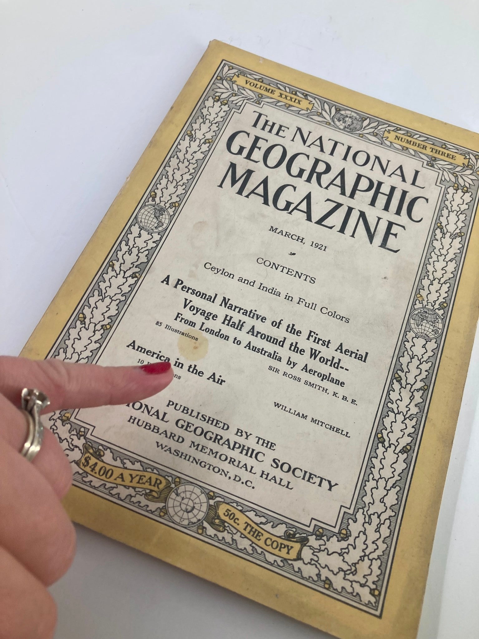 Cover of The National Geographic Magazine March 1921 titled America in the Air, featuring historical aviation content.