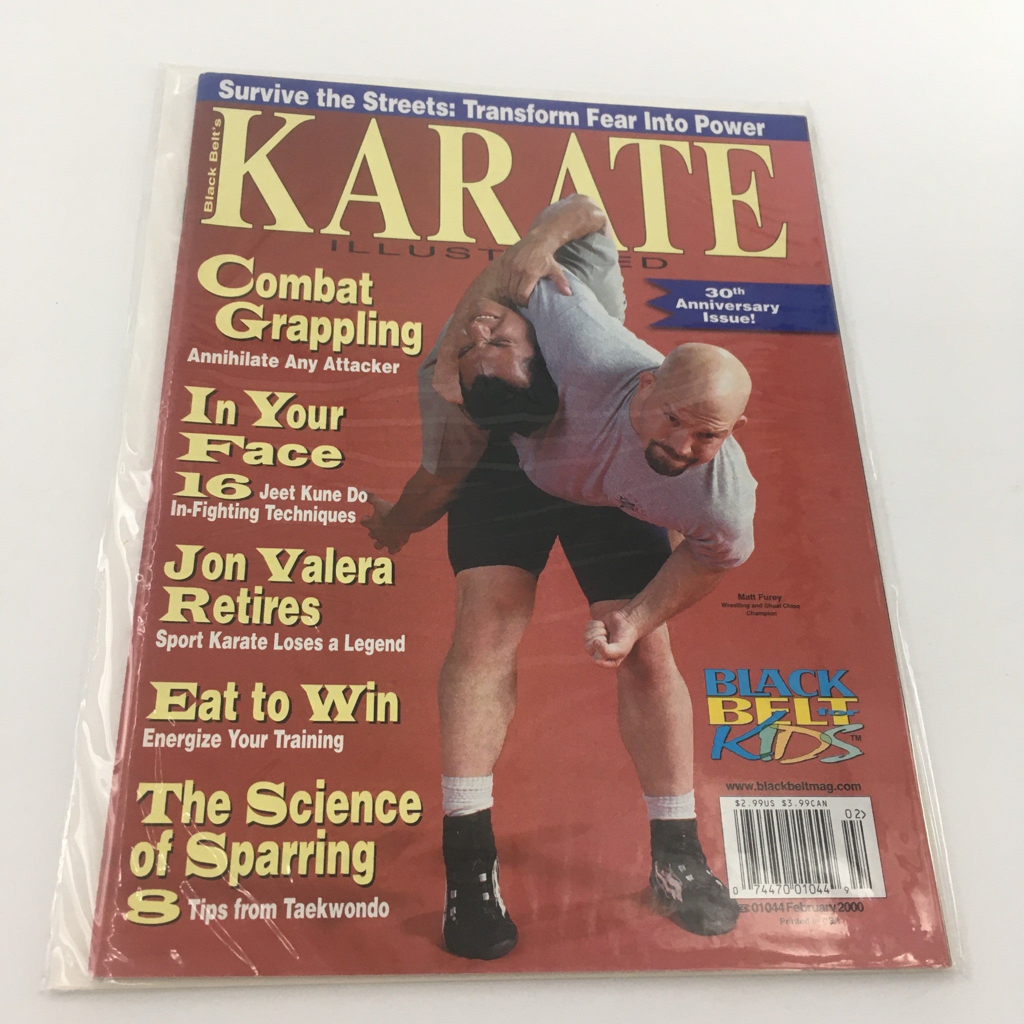 Cover of Karate Illustrated Magazine, February 2000, featuring Matt Furey. This edition showcases topics like Combat Grappling and Eat to Win food tips, marking the 30th Anniversary of the magazine. Ideal for martial arts enthusiasts and collectors.