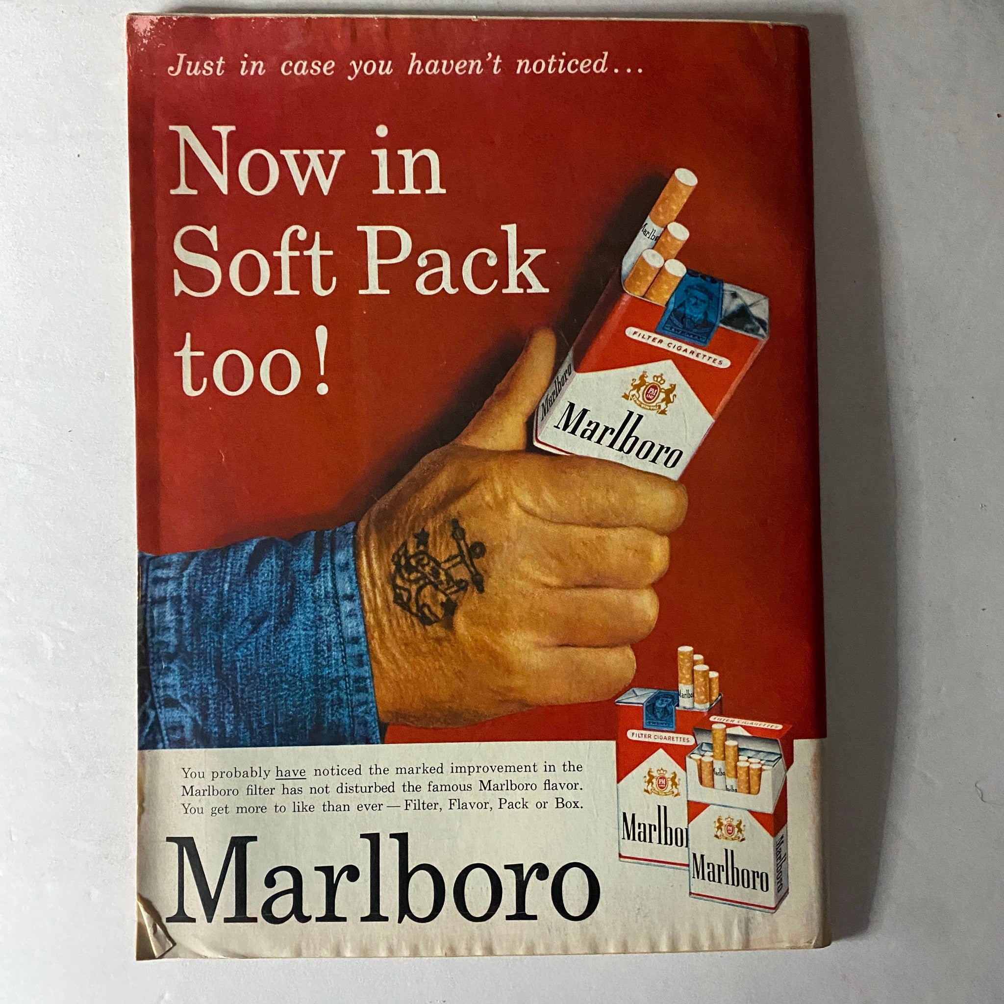 Vintage Marlboro advertisement promoting soft pack cigarettes, highlighting the brand's marketing in the mid-20th century.