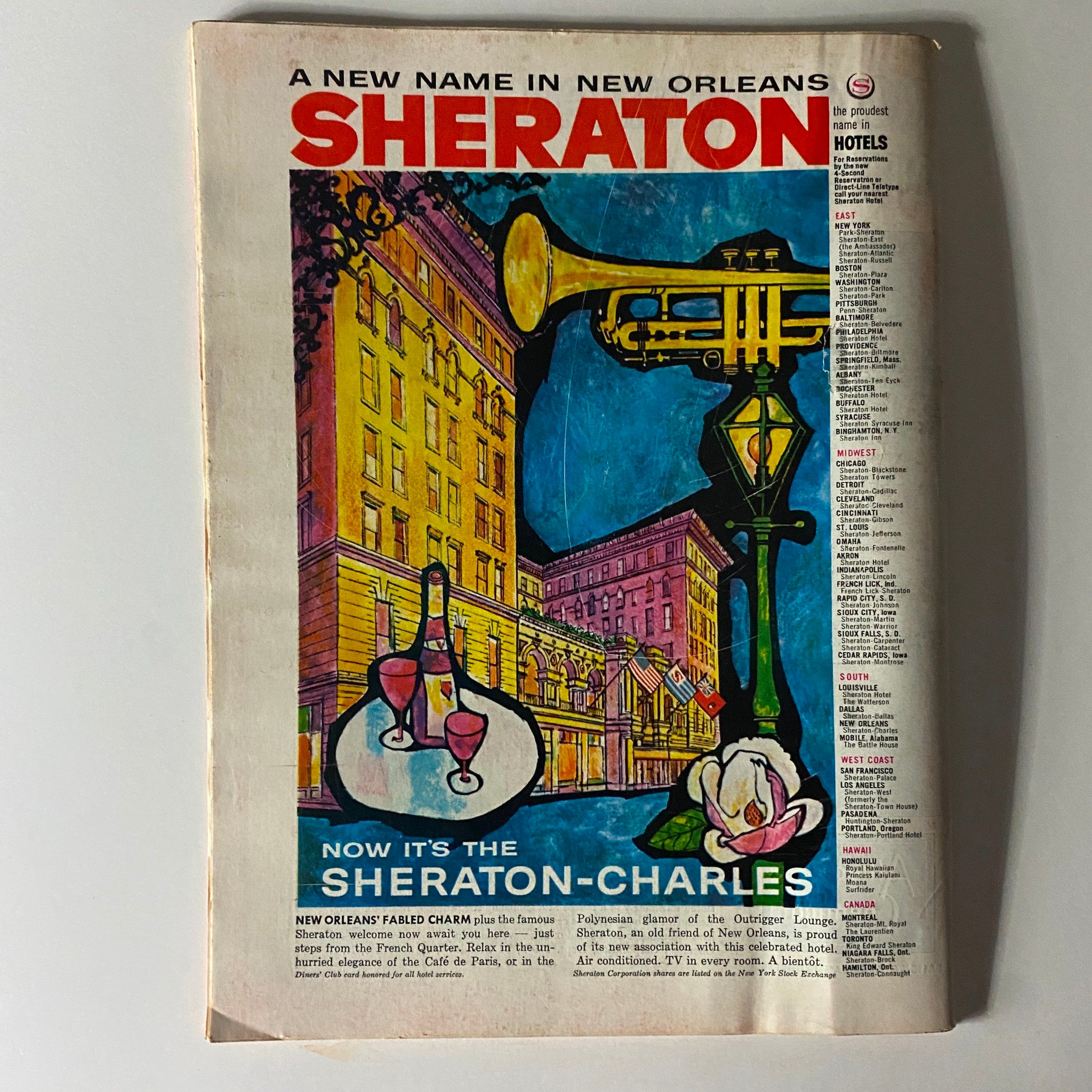 Ad for Sheraton Hotels on the back cover of a vintage magazine, highlighting the Sheraton-Charles in New Orleans with colorful illustrations.