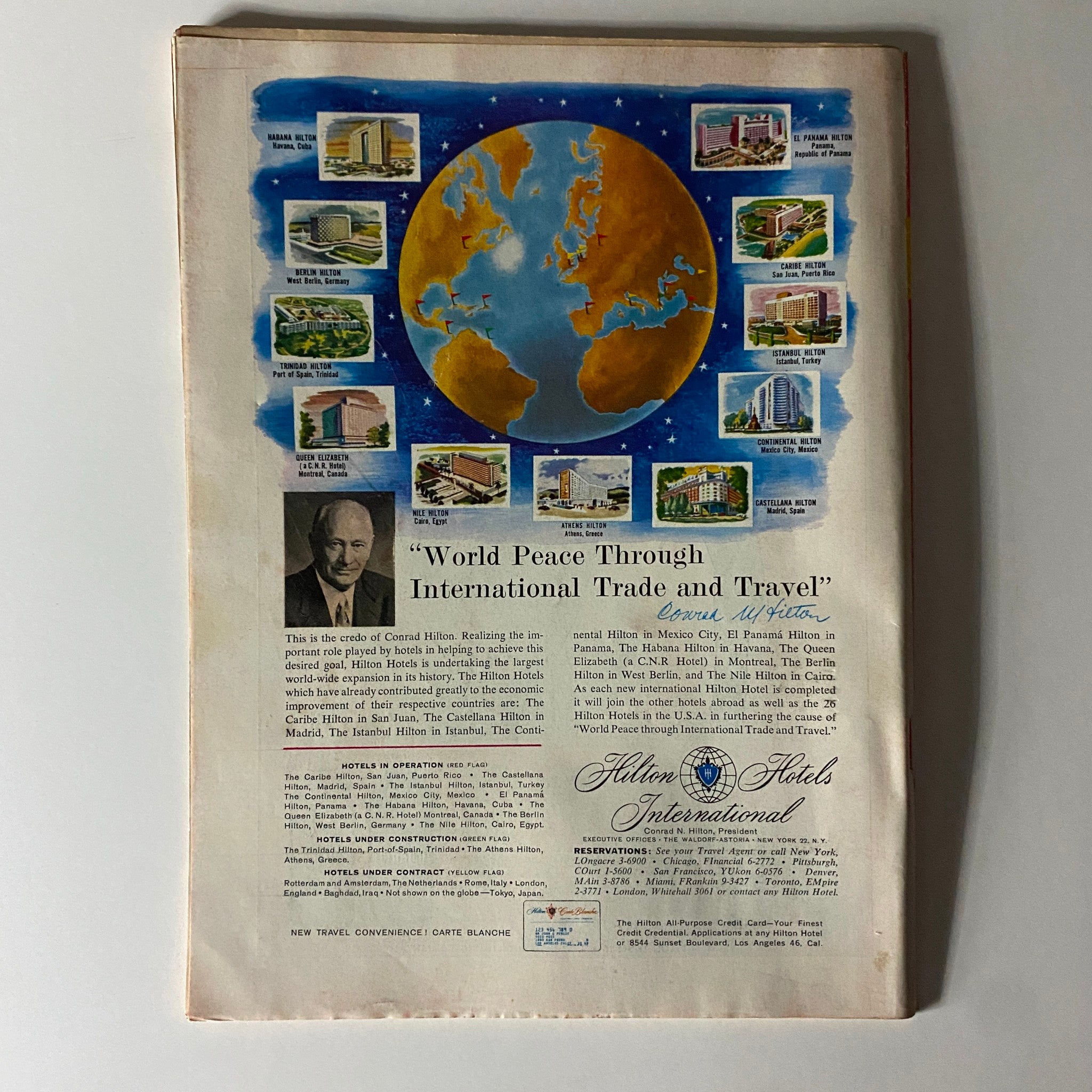 Back cover of Time Magazine from June 15, 1959, showcasing a colorful illustration centered on global trade and travel, promoting Hilton Hotels. The edition belongs to Volume 73, Number 24 featuring Lewis Strauss on the front.