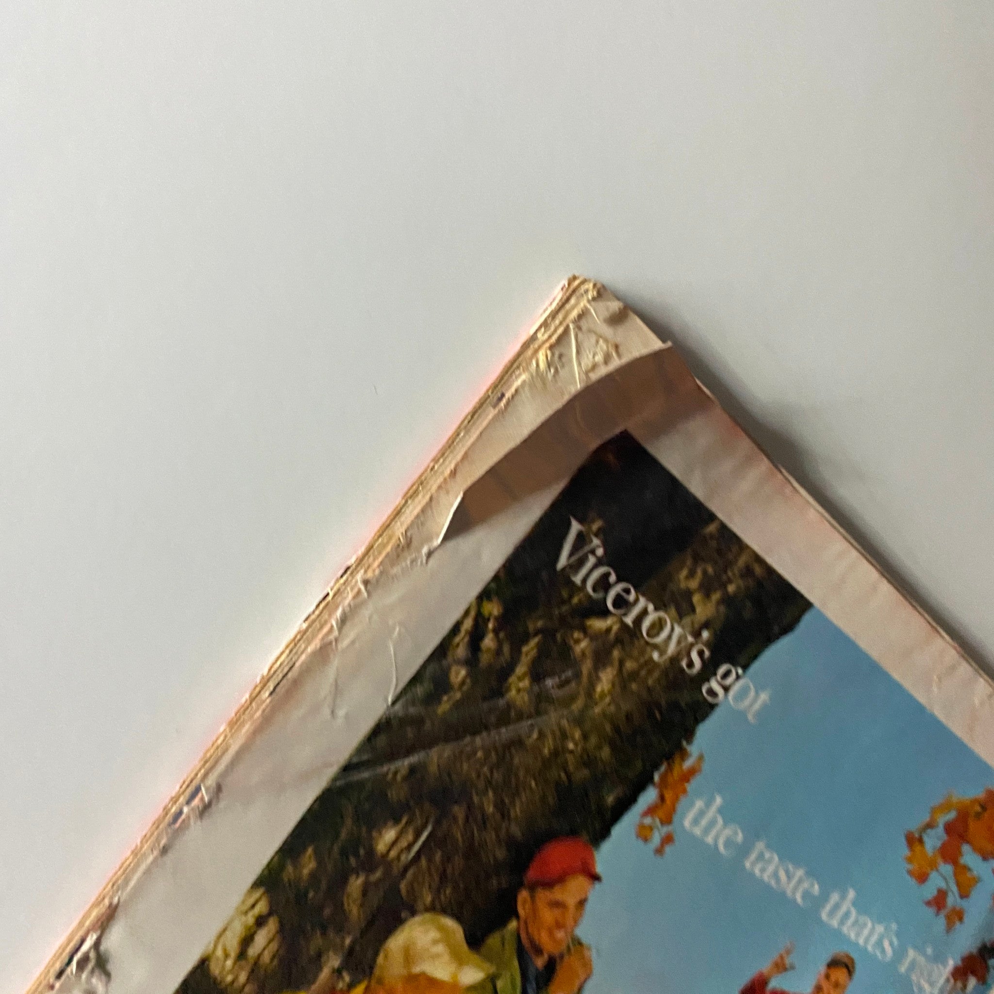 Close-up of the corner of a vintage Viceroy cigarette advertisement, highlighting the wear and charm of the magazine cover with the slogan 'Viceroy's got the taste that's right'.